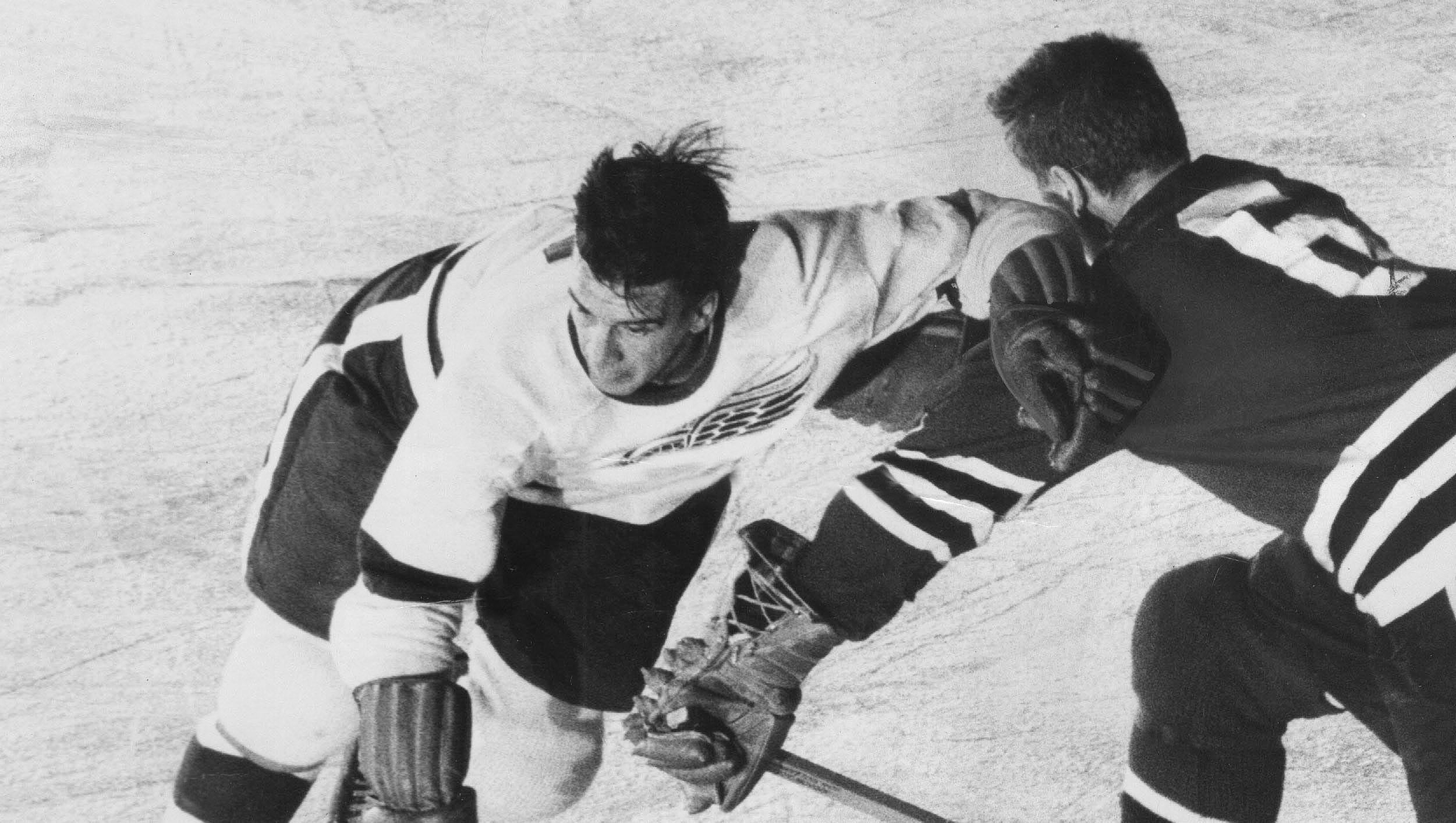 Ted Lindsay of the Detroit Red Wings  elbows his way past No. 6 Benny Woit of Chicago, October 20, 1955. While only 5 feet 8, Lindsay was a tough forward, often referred to as "Terrible Ted."