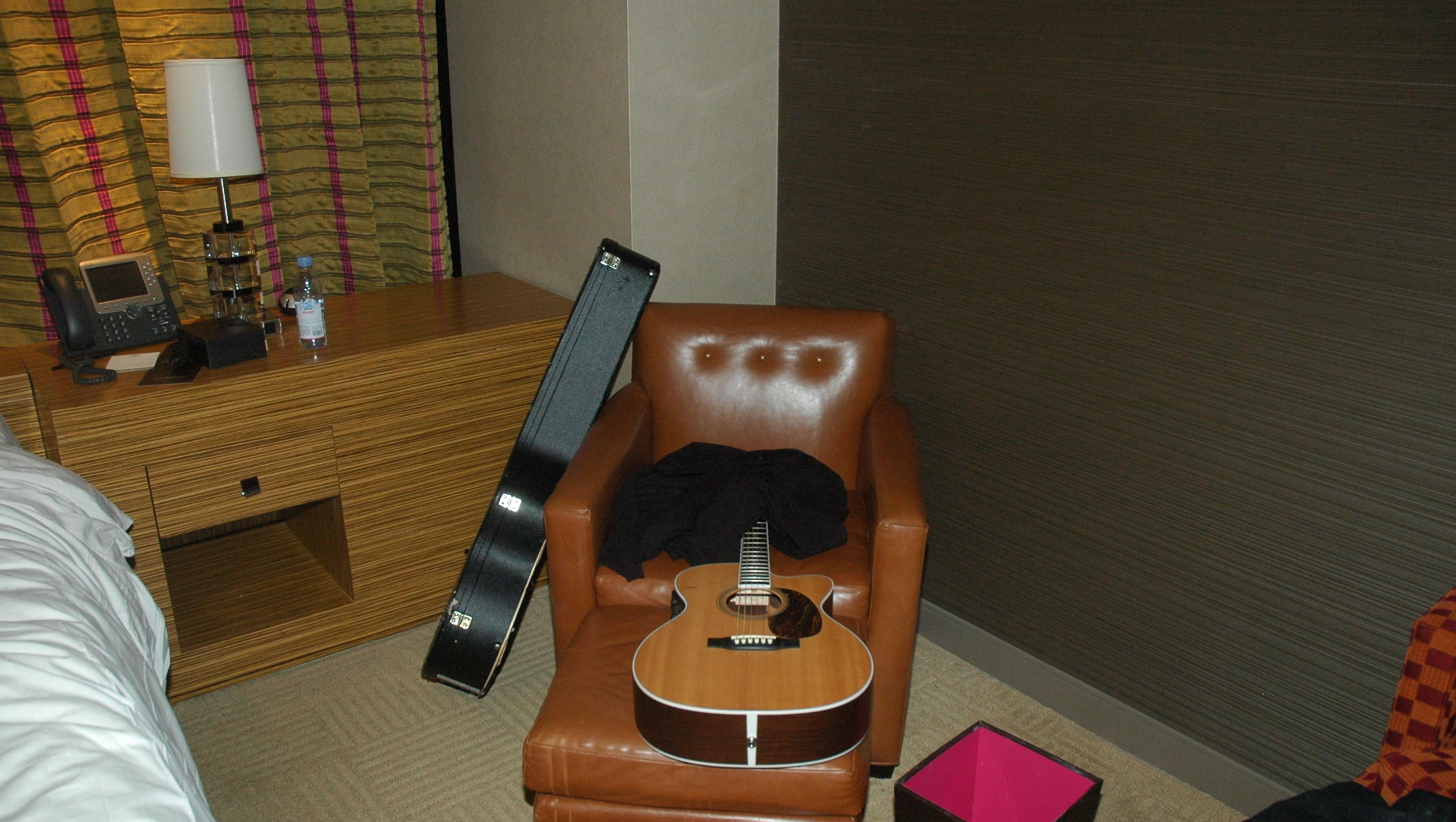 Cornell's acoustic guitar sits on a chair in his hotel room.