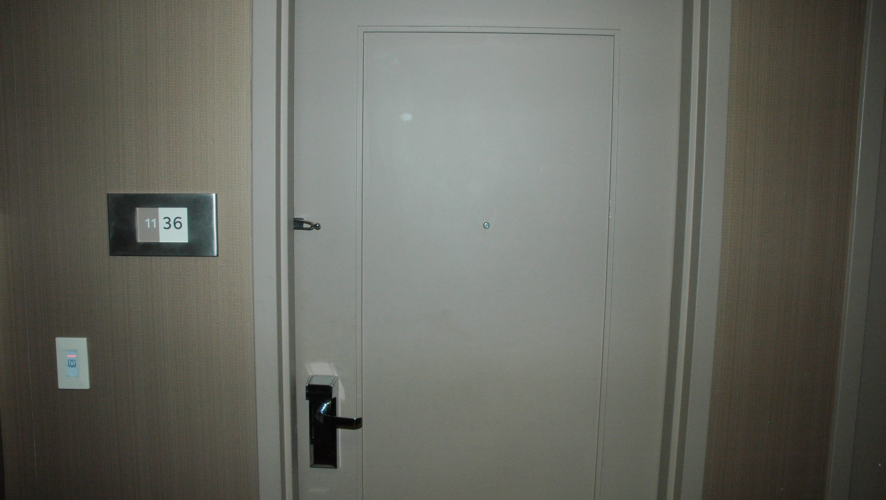 A photo of the outer door to Cornell's hotel room.