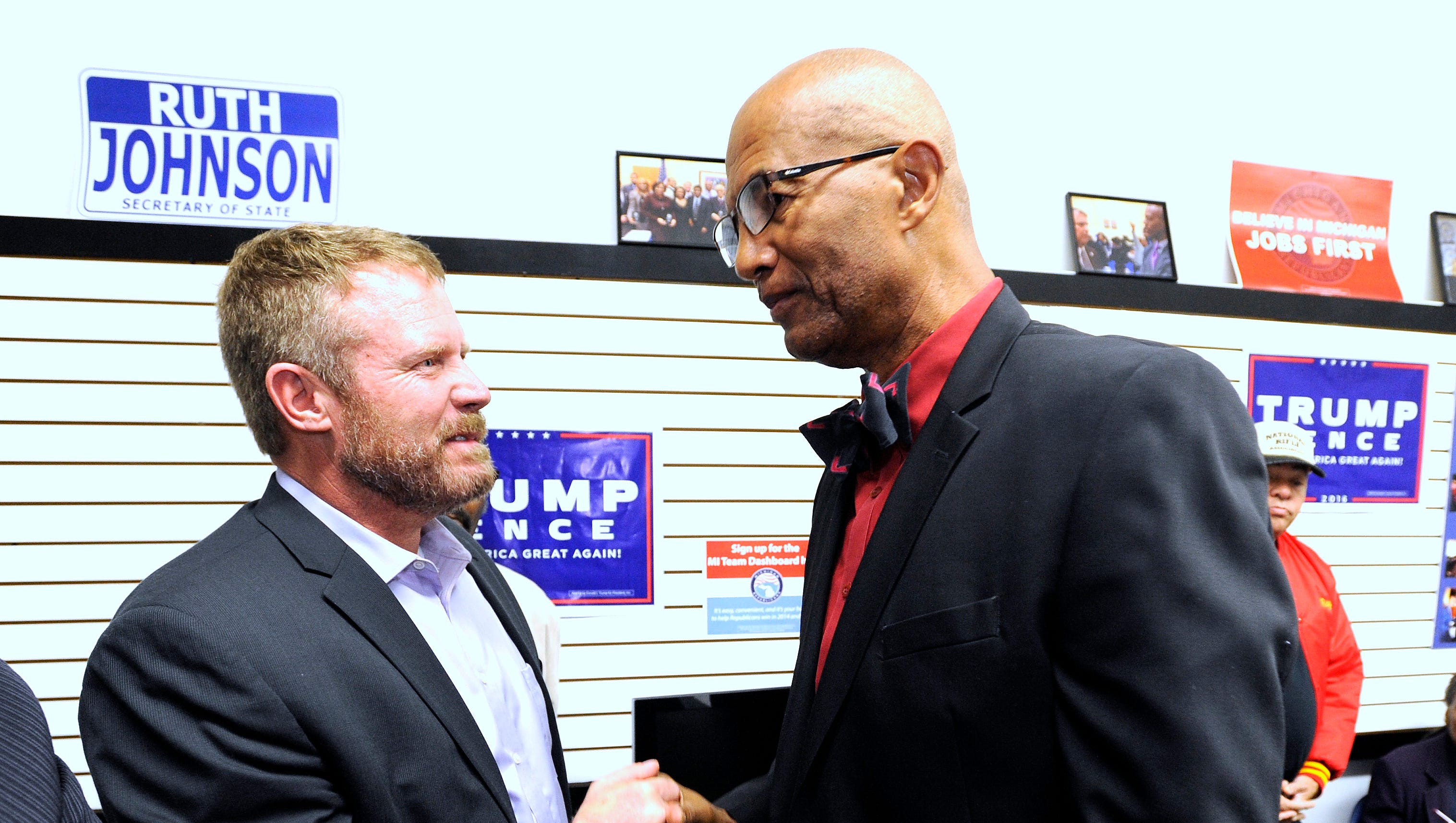 Jerome Barney, right, 67 of Southfield, shakes hands with retired U.S. Marine Mark "Oz" Geist, left, of Colorado, during the event. Barney is a lawyer and board member of the Michigan Black Chamber of Commerce as Geist served in the U.S. Marines for 12 years as an interrogator and translator speaking Farsi as a second language.