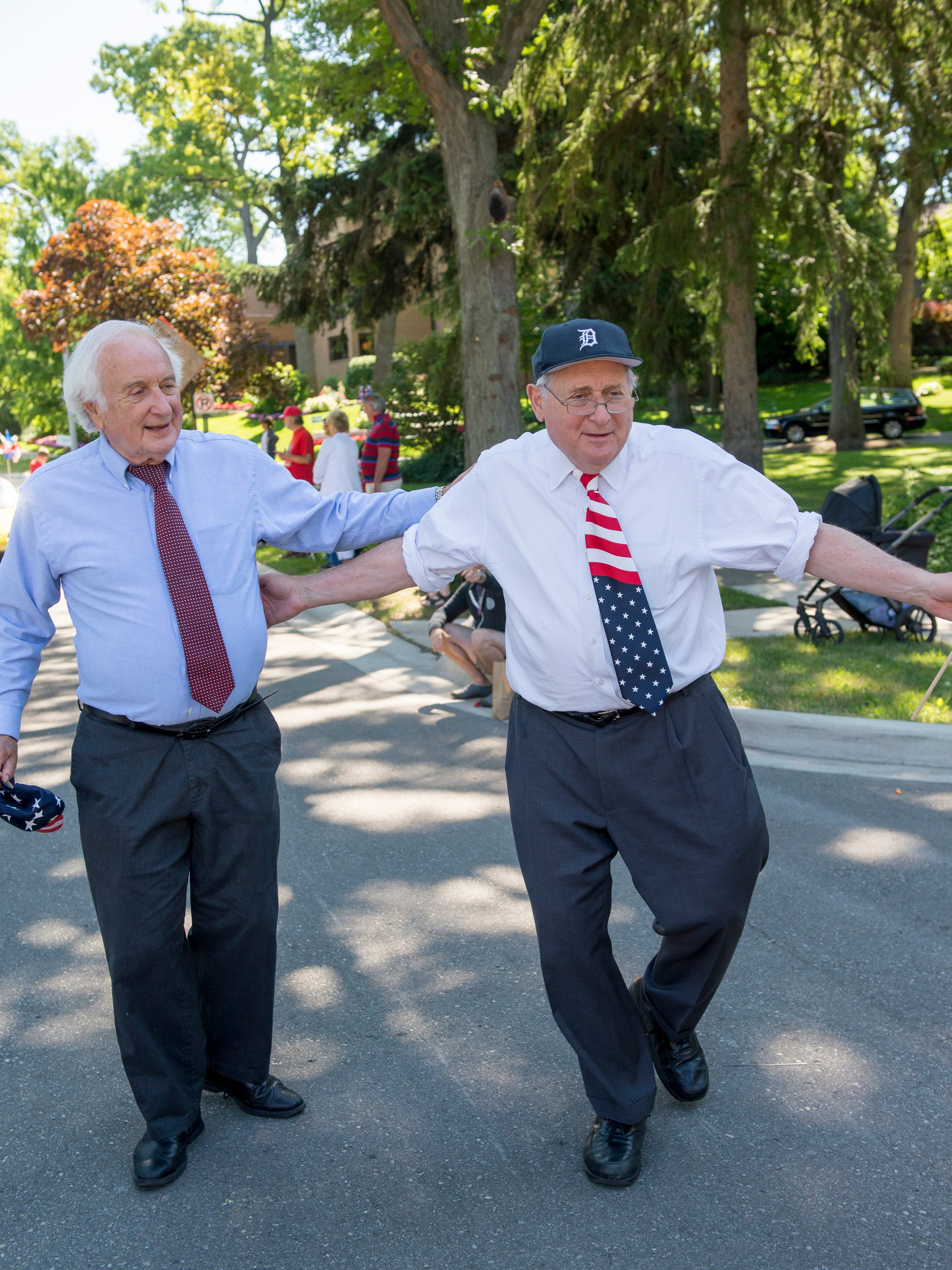 U.S. Rep.Sander Levin, left, and U.S. Sen. Carl Levin walk during the 2014 Huntington Woods 4th of July Parade.