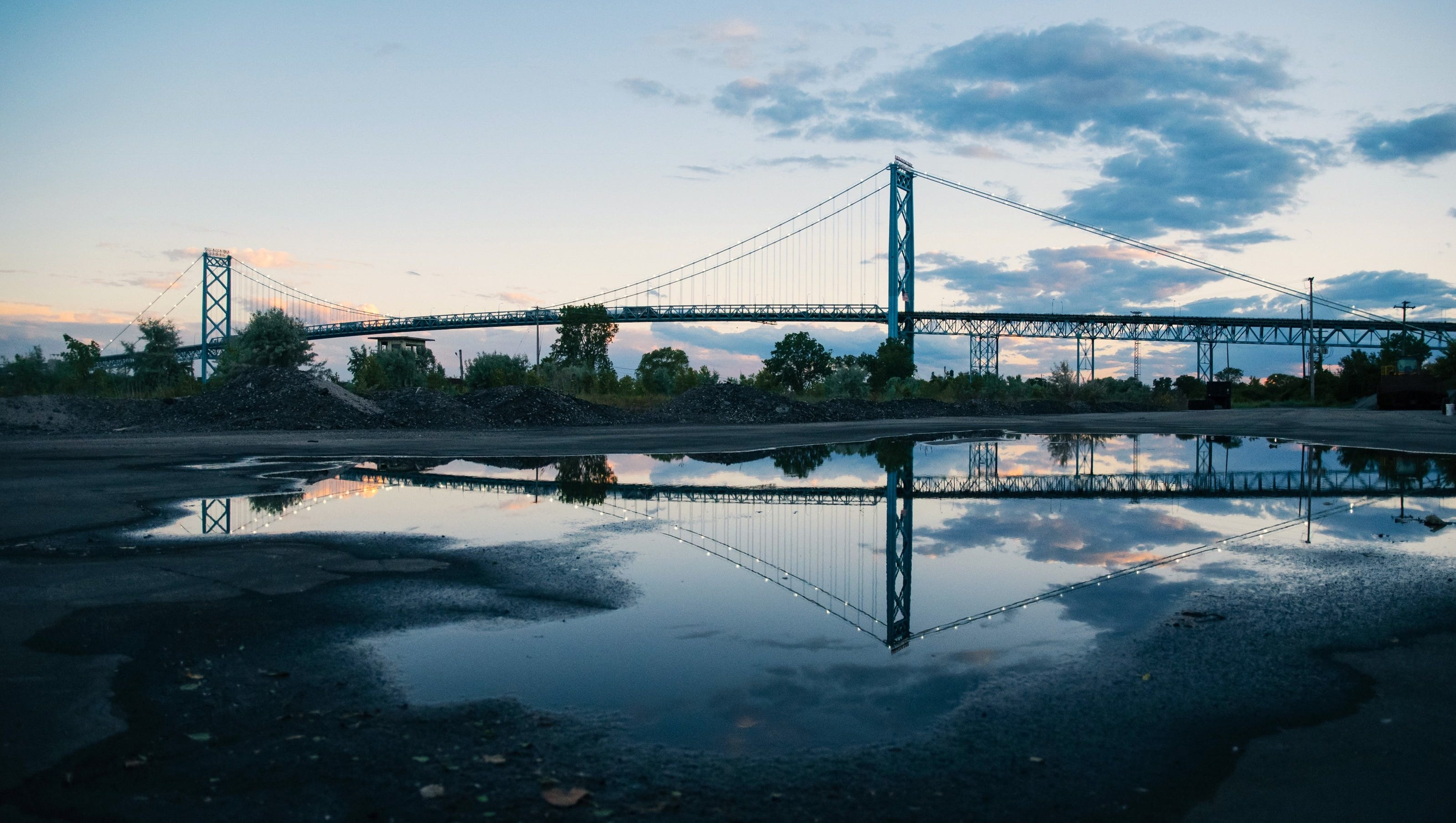 "Mirror Bridges," by Liz Haack of Royal Oak. She saw this puddle on her way to the Ford Fireworks. "The Ambassador Bridge is such a cool part of Detroit.  I'm glad I had my camera with me!"