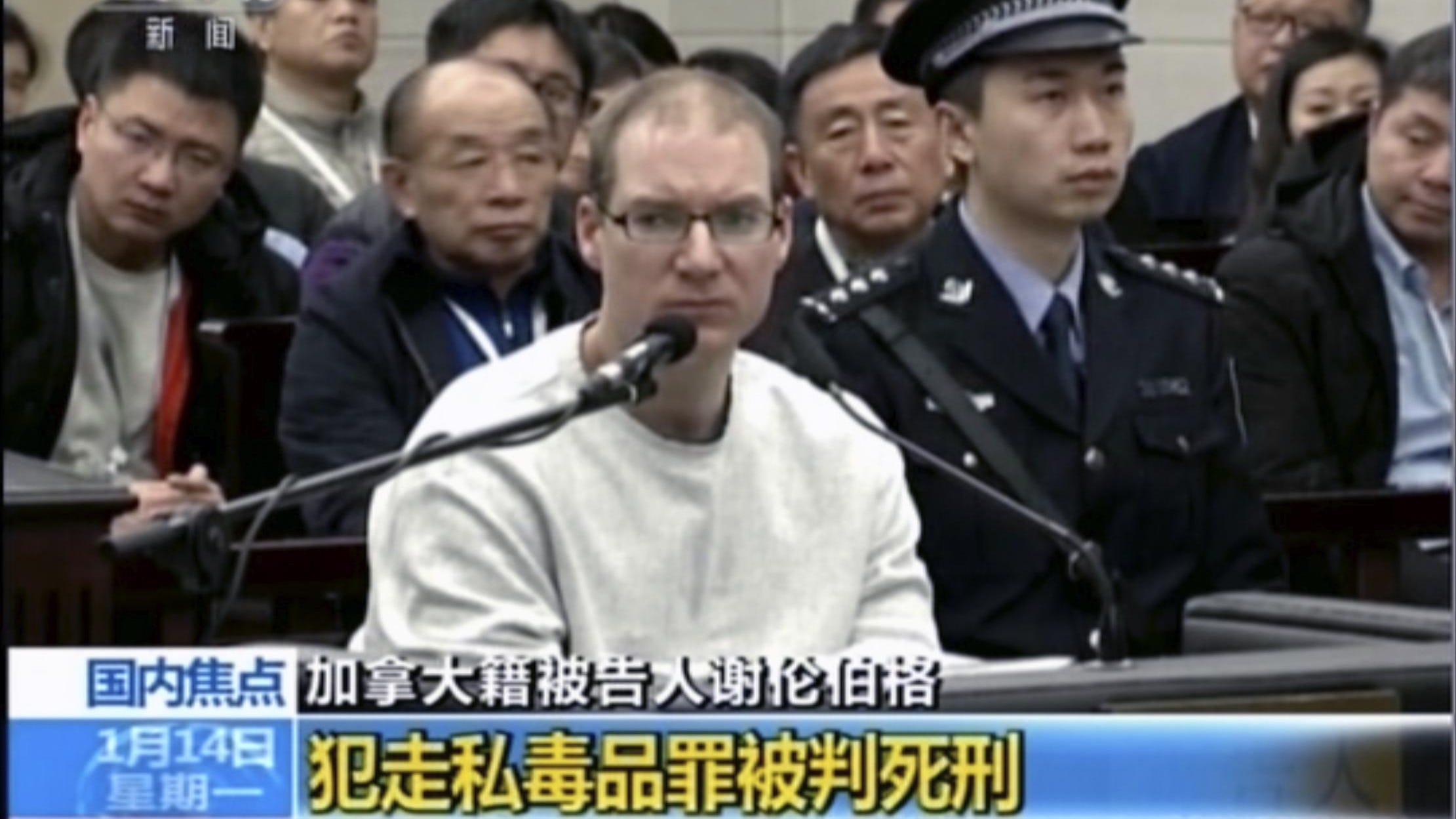 In this image taken from a video footage run by China's CCTV, Canadian Robert Lloyd Schellenberg attends his retrial at the Dalian Intermediate People's Court in Dalian, northeastern China's Liaoning province on Jan. 14, 2019. A Chinese court sentenced the Canadian man to death Monday in a sudden retrial in a drug smuggling case that is likely to escalate tensions between the countries over the arrest of a top Chinese technology executive.