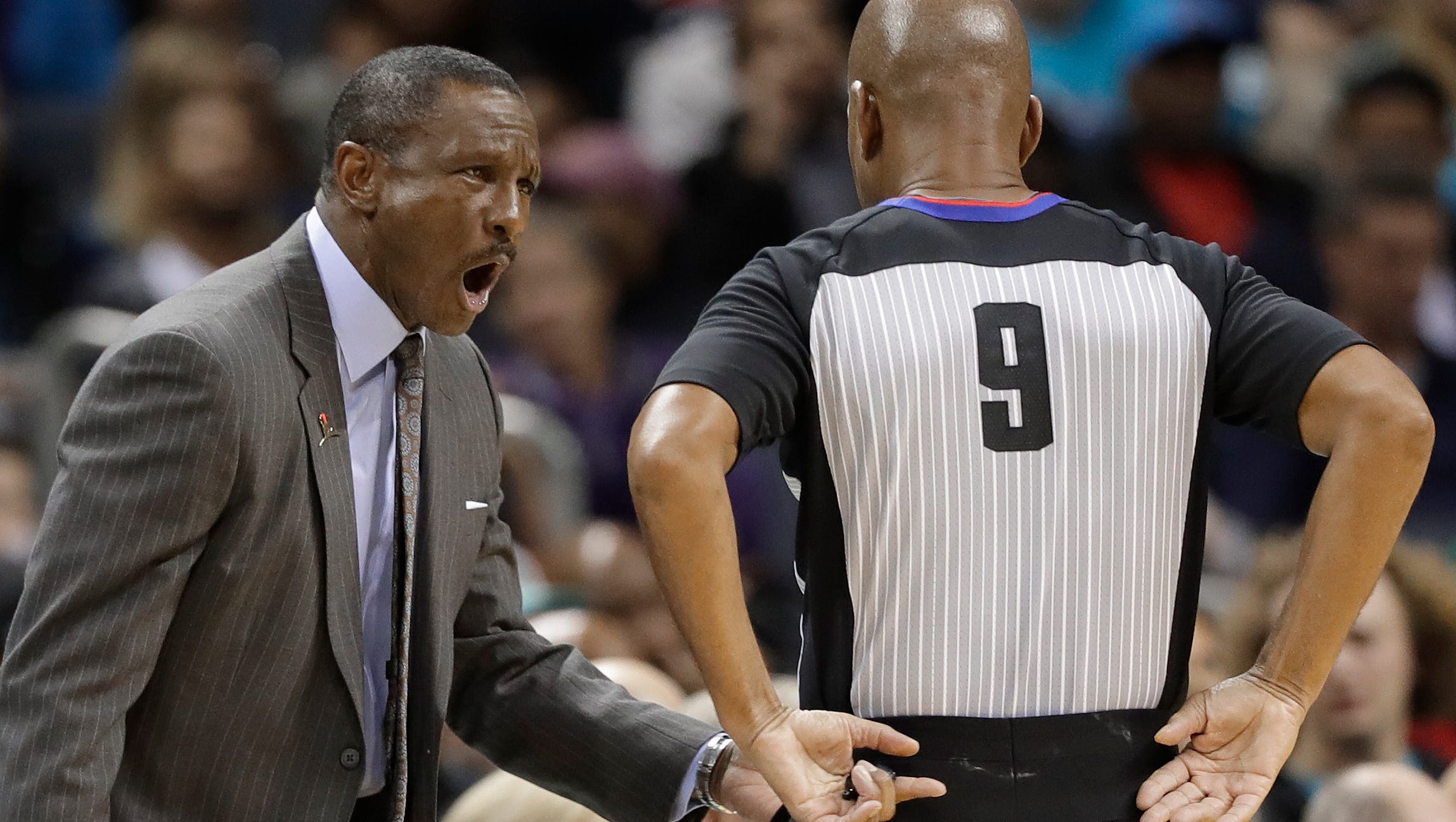 Toronto Raptors coach Dwane Casey, left, argues a call during the second half of the team's NBA basketball game against the Charlotte Hornets in Charlotte, N.C., Wednesday, Dec. 20, 2017.