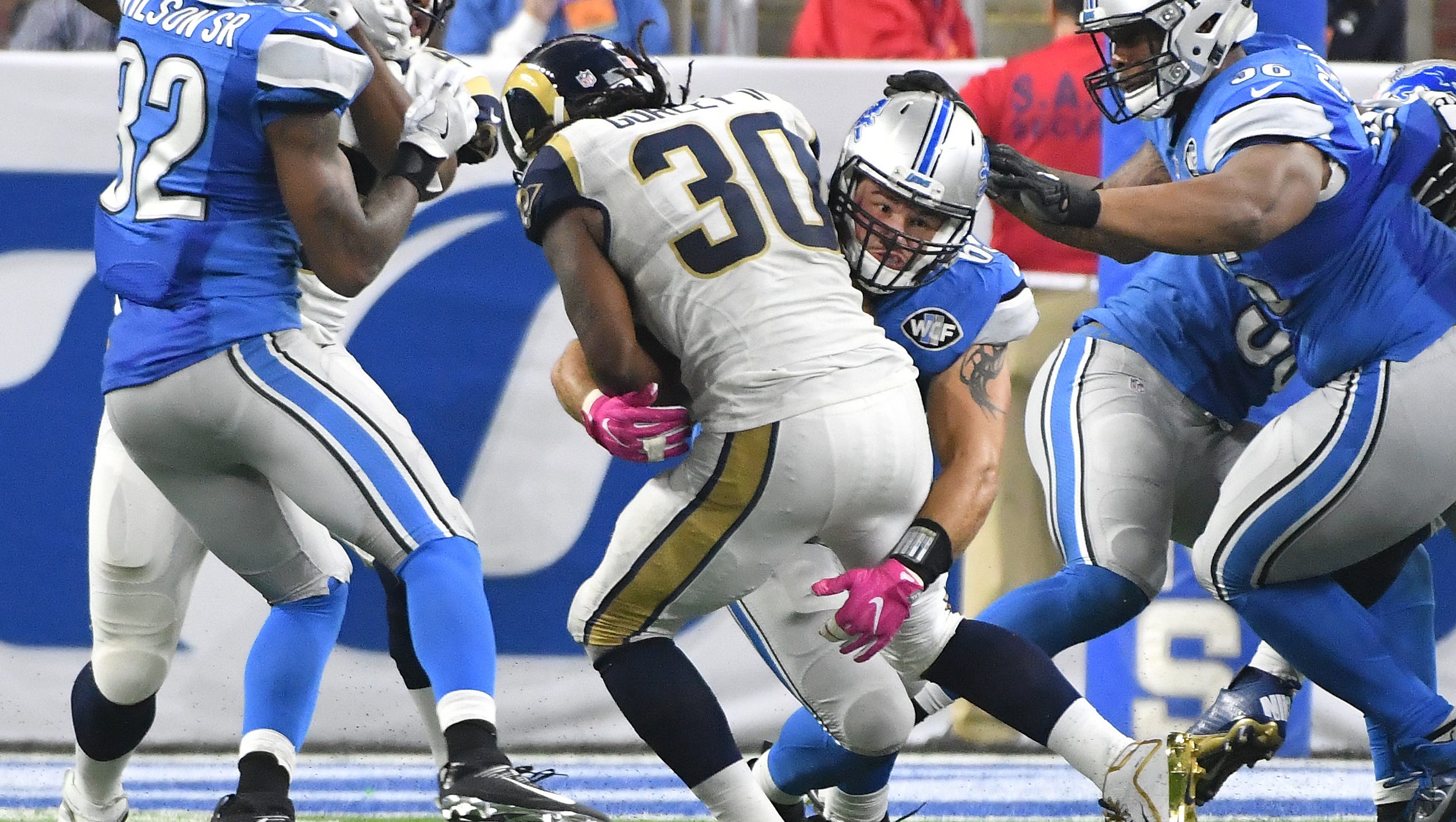 Lions Anthony Zettel picks up Rams running back Todd Gurley cutting through a hole and puts him down to the turf in the third quarter.