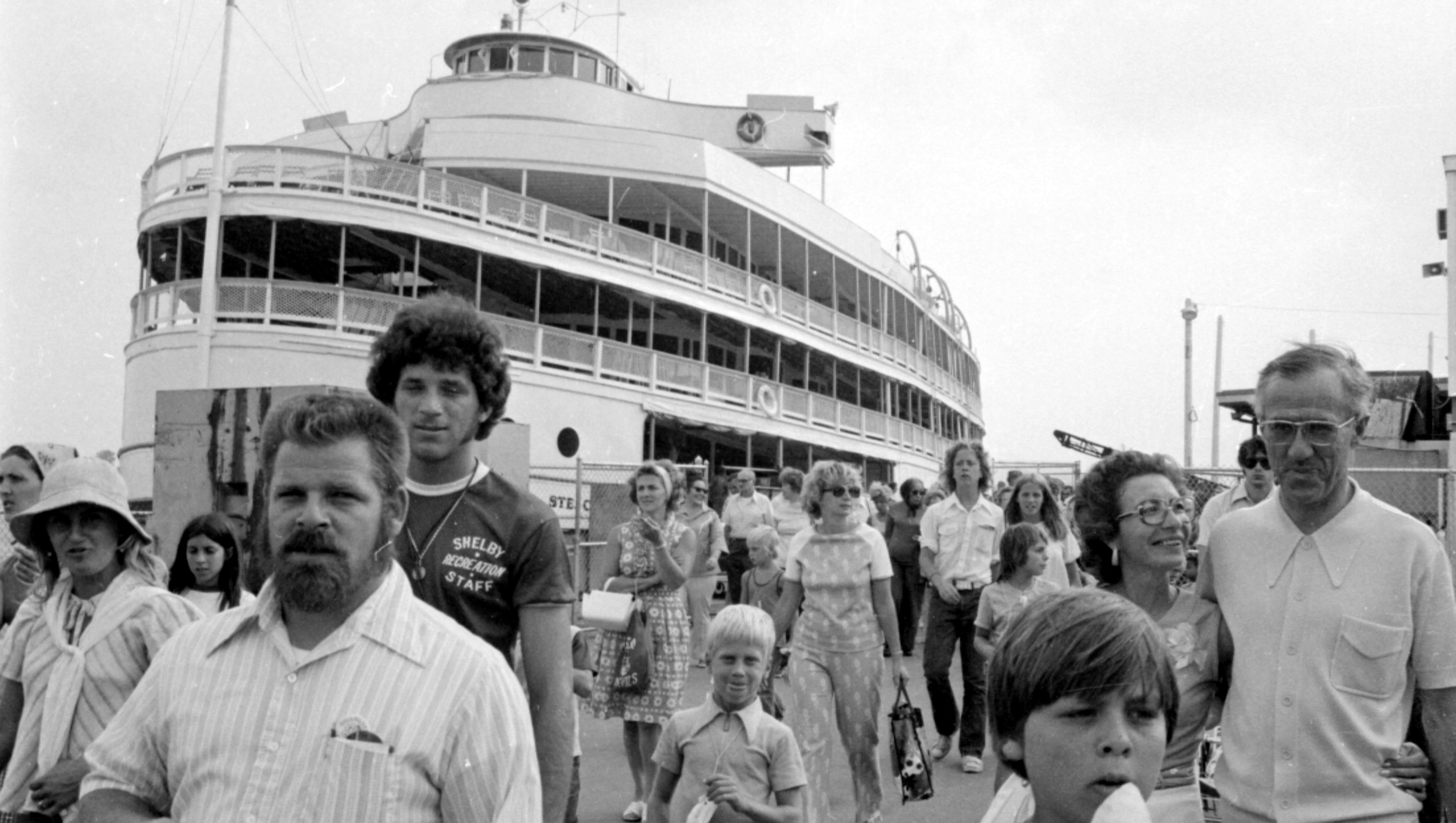 Passengers disembark from a Boblo boat, circa 1970s.
