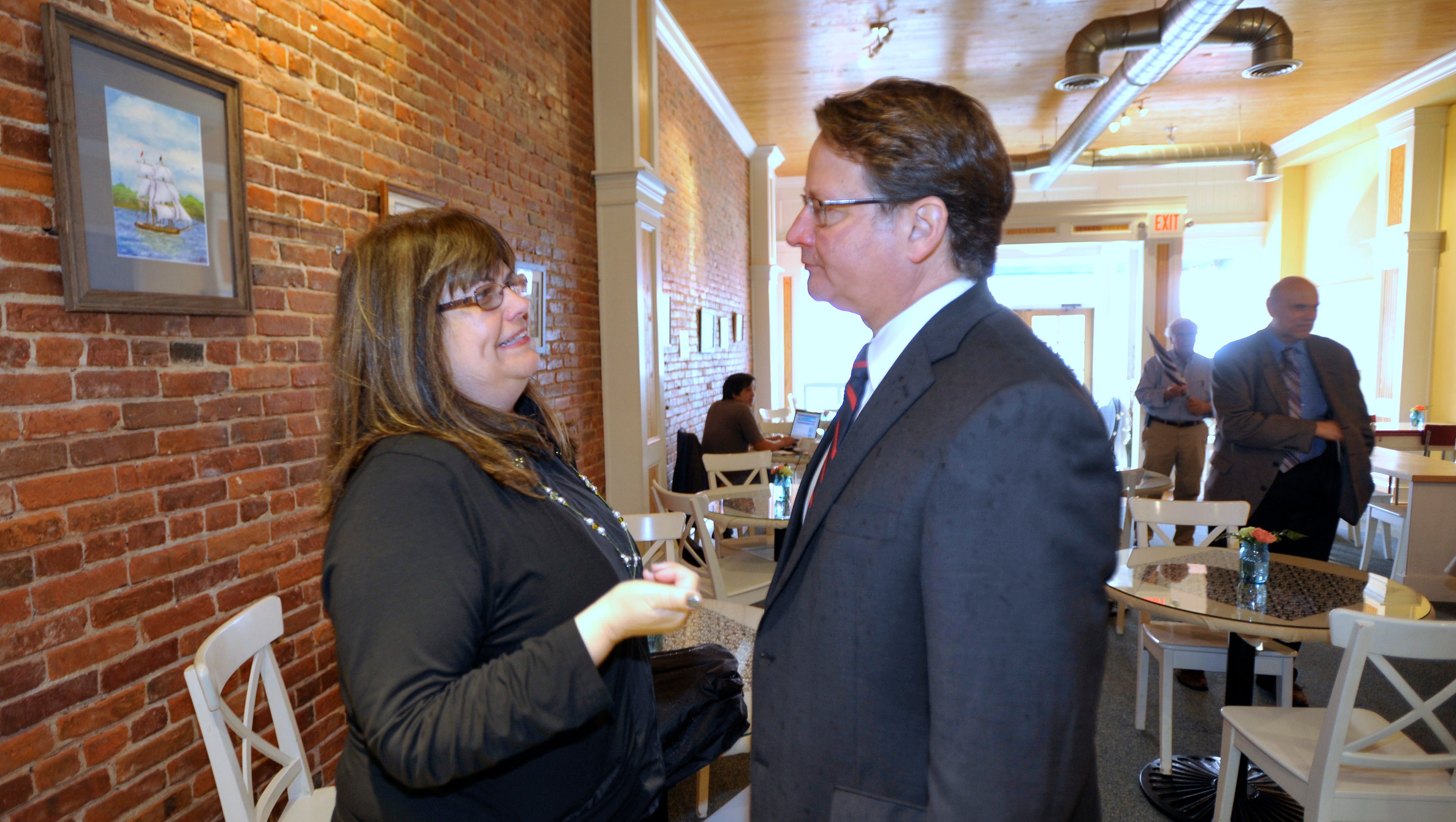 U.S. Congressman Gary Peters, right, talks with friend Kathie Trongo, left, of Port Huron, before lunch at Kate's Downtown.