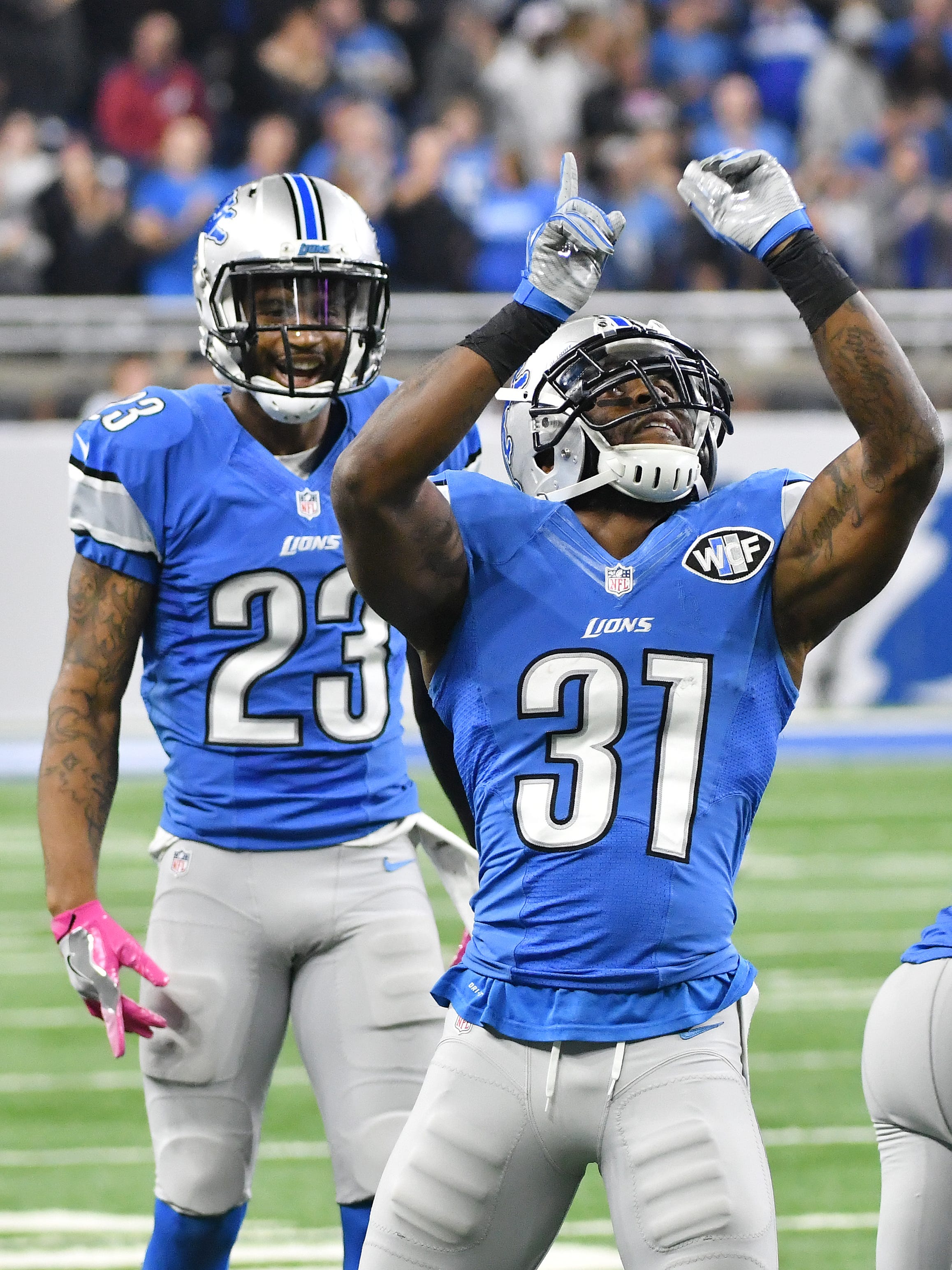 Lions safety Rafael Bush points skyward after his late fourth quarter interception to seal Detroit's victory.