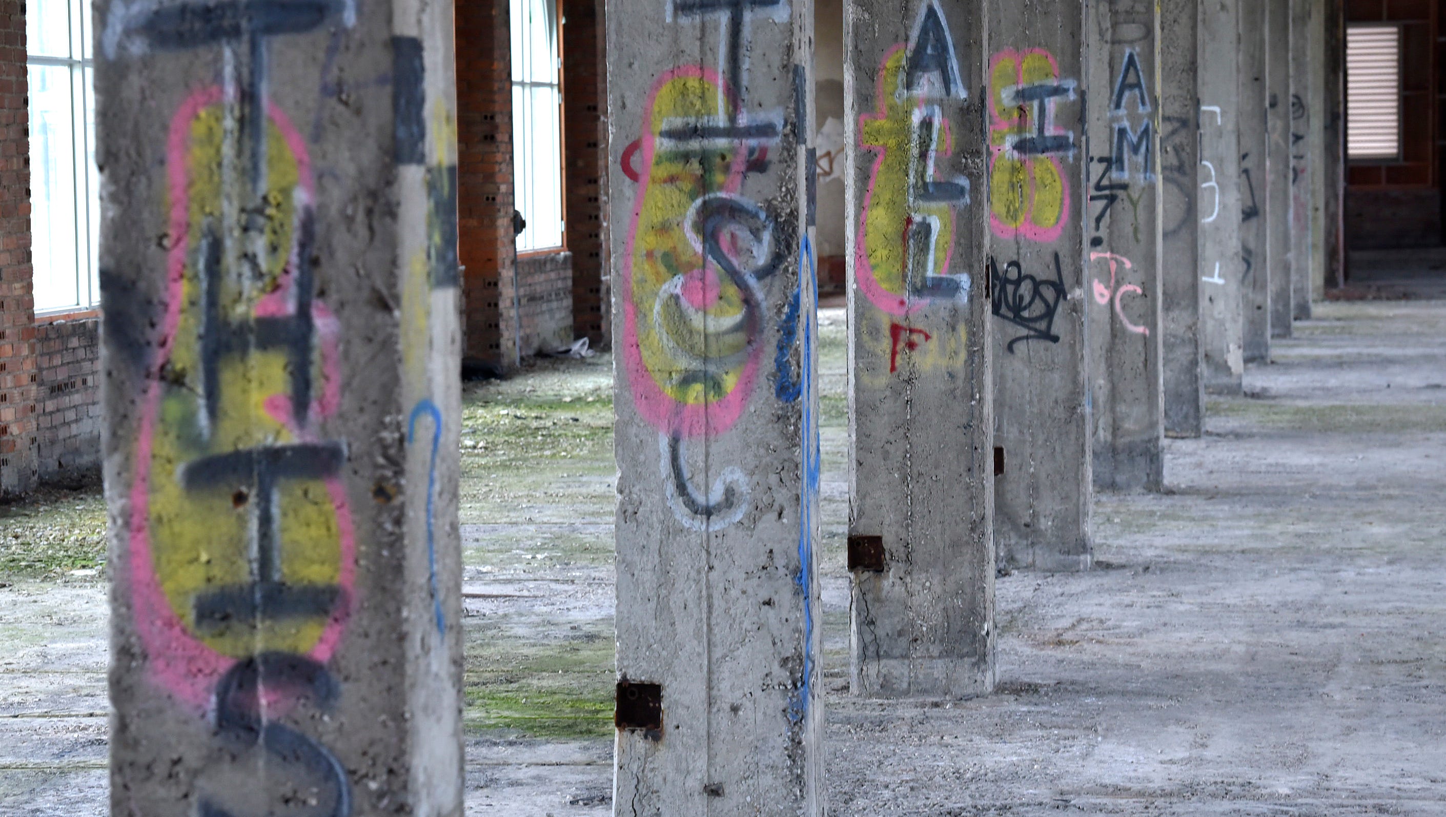 Graffiti that says, "This Is All I Am," is written on columns on the 13th floor of the train station.