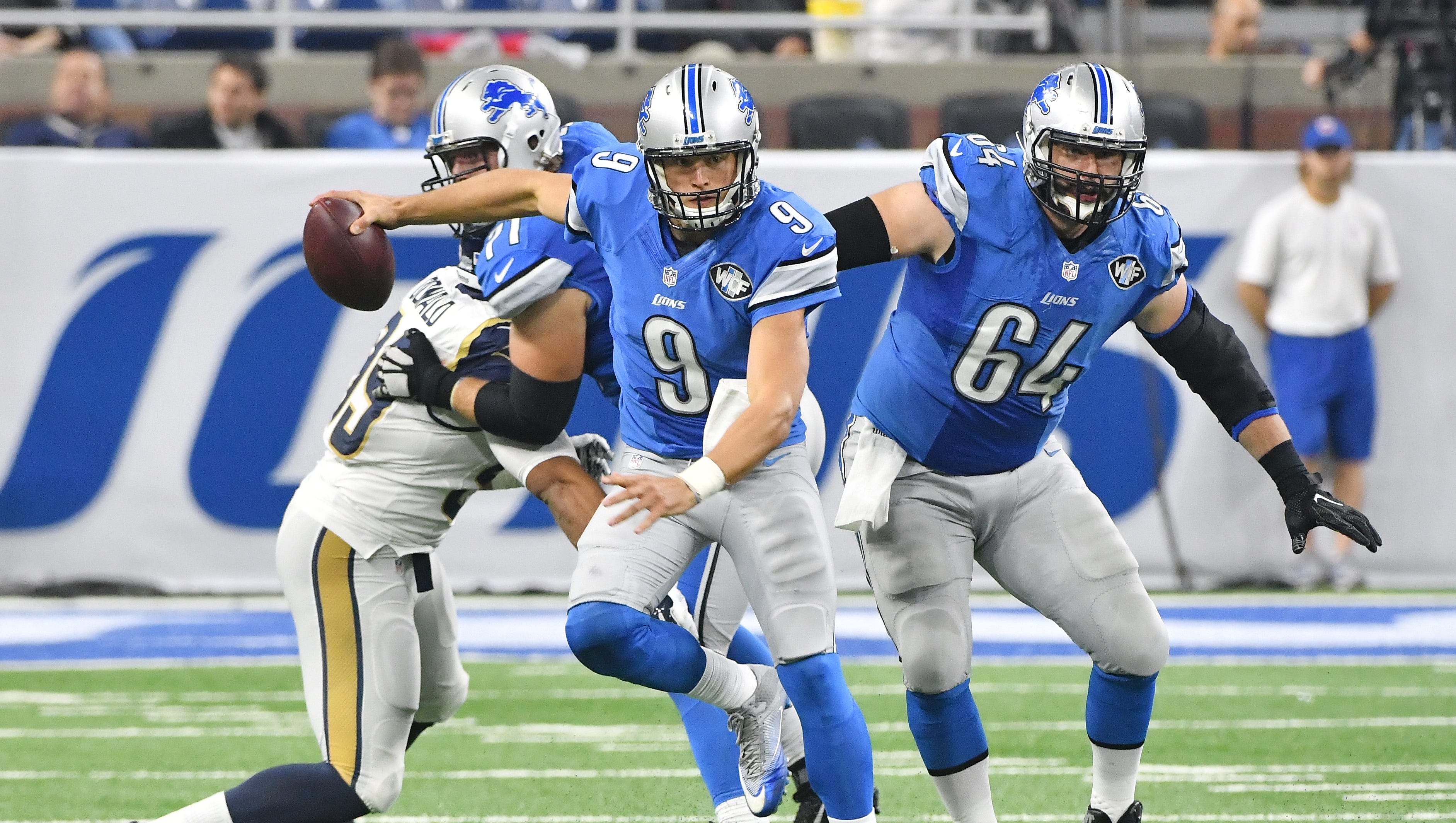 Lions quarterback Matthew Stafford scrambles out of the pocket and down the field on a run in the third quarter.