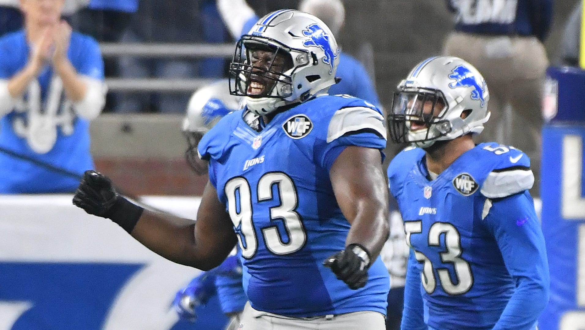 Lions Tyrunn Walker celebrates after stopping Rams running back Todd Gurley on 4th down and 1 to end the second quarter tied at 14.