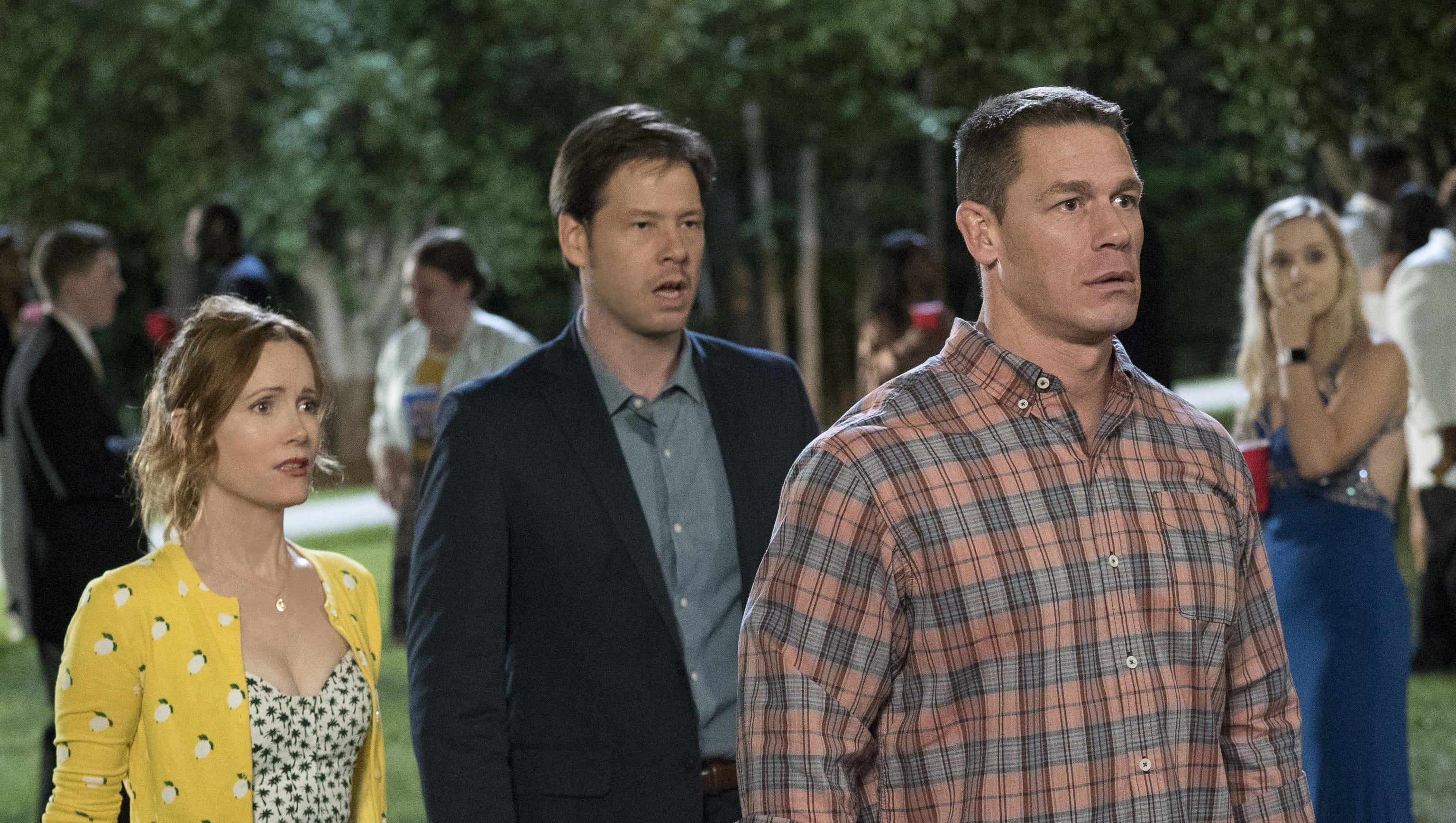 Leslie Mann, left, Ike Barinholtz and John Cena play protective parents in the comedy “Blockers.”