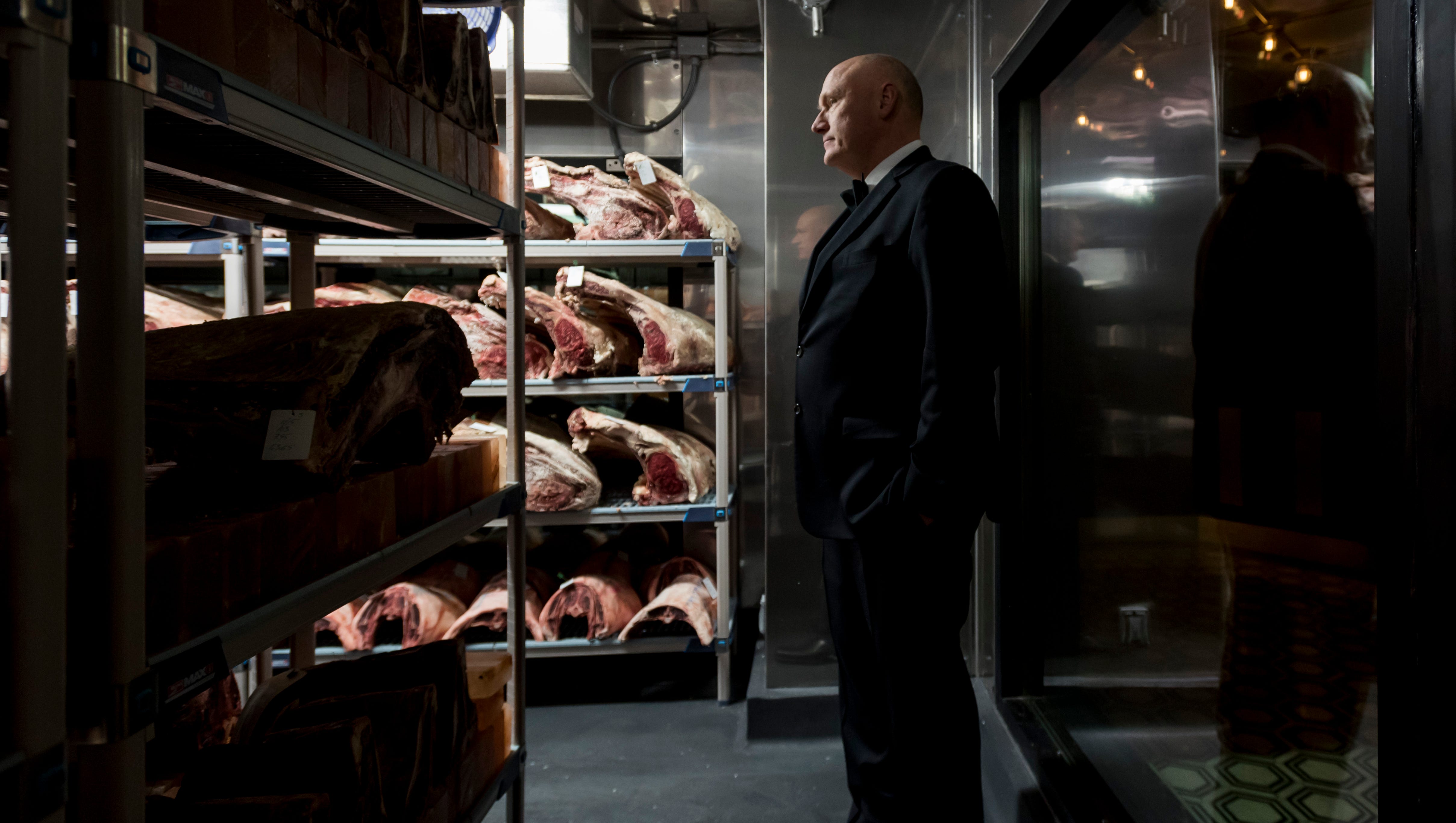 Curtis Noreen, managing director, standing inside the dry aging room.
