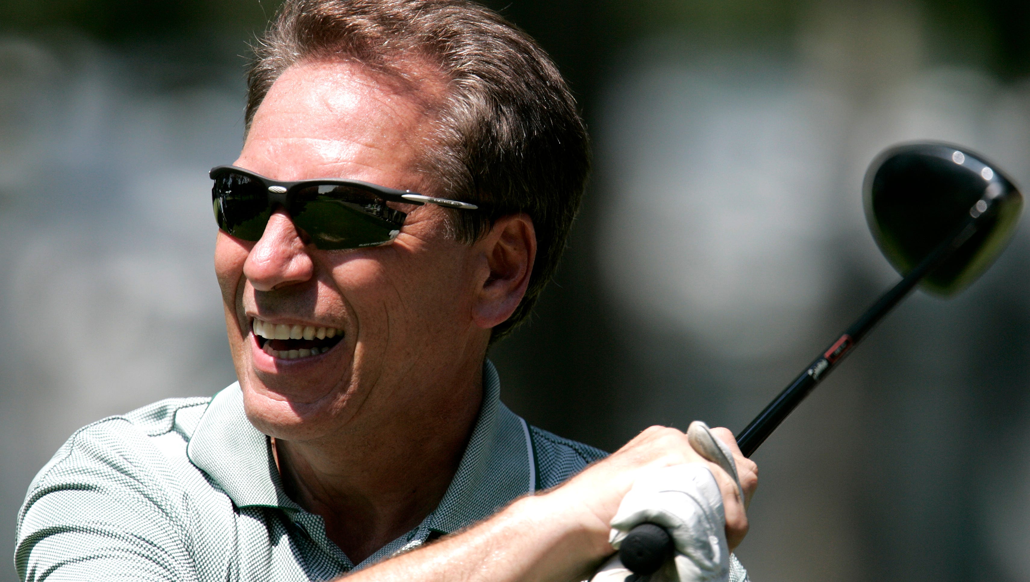 Tom Izzo watches his tee shot on the 12th hole at the 2006 Buick Open pro-am.