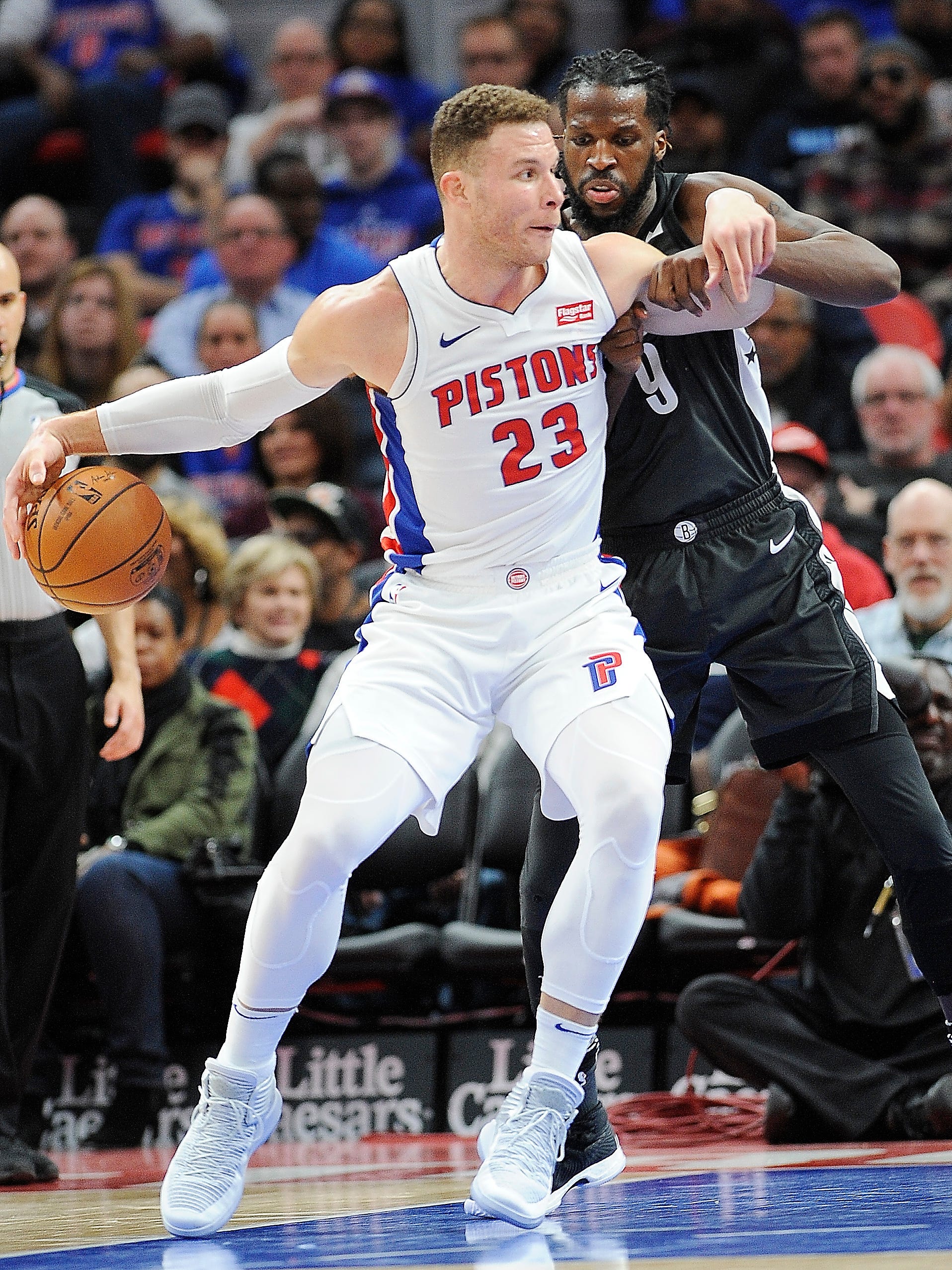 Pistons' Blake Griffin drives around Nets' DeMarre Carroll in the second quarter.