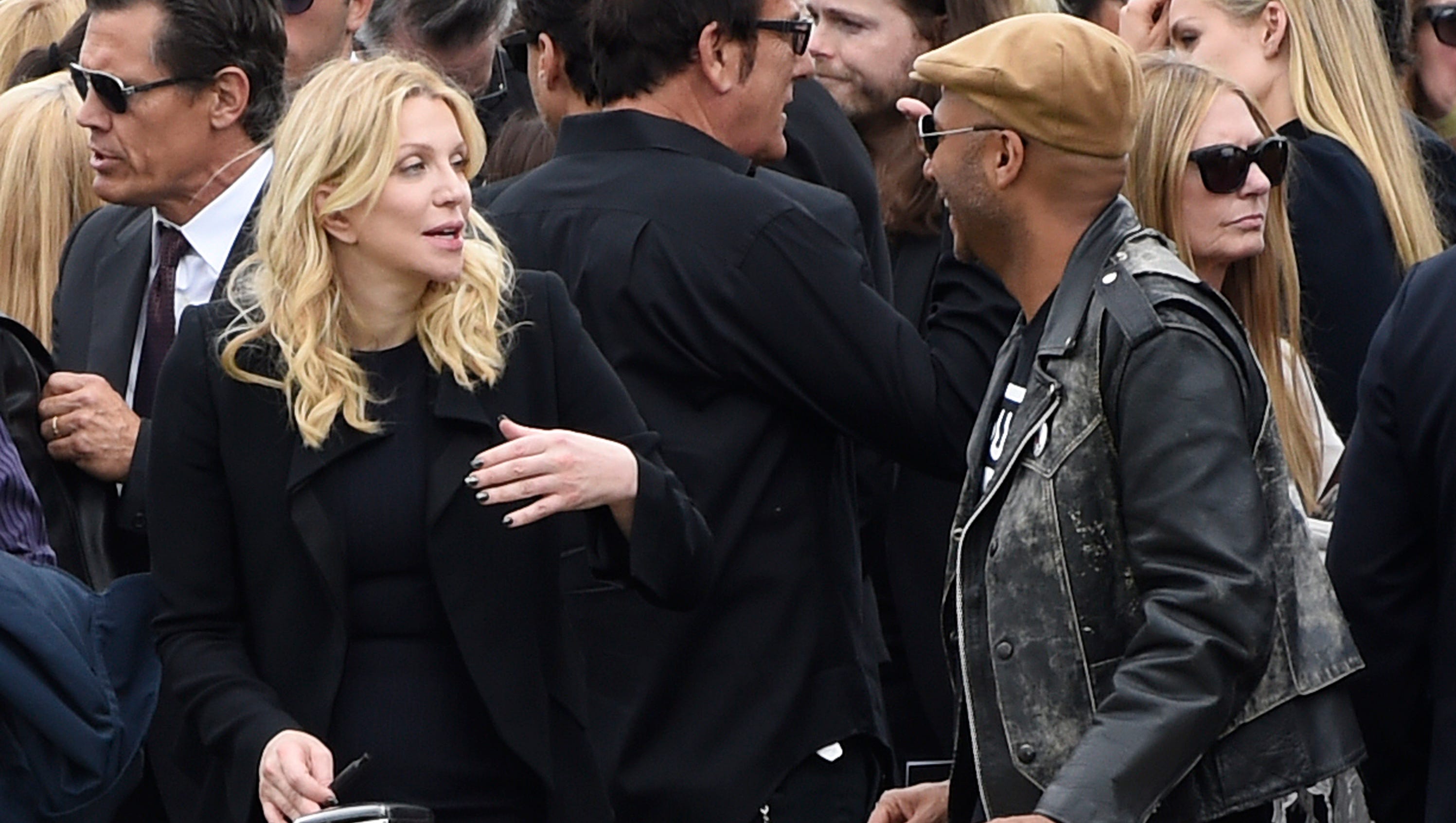 Courtney Love, left, and Tom Morello attend a funeral for Chris Cornell at the Hollywood Forever Cemetery on Friday, May 26, 2017, in Los Angeles.