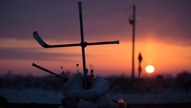 Hockey sticks mark the scene of the tragic Humboldt bus accident, which claimed the lives of 16 members of the Canadian junior-hockey team. For a look back at the notable sports deaths of 2018, scroll through the gallery.