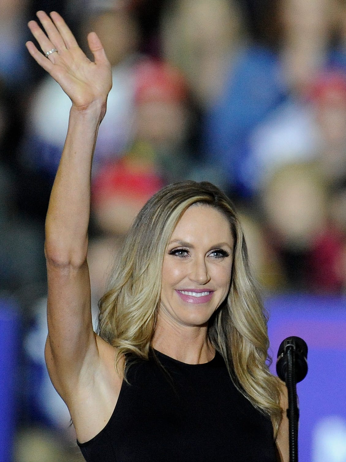 Lara Trump, daughter-in-law to President Trump and wife to his second son, Eric Trump, waves at the crowd after speaking.