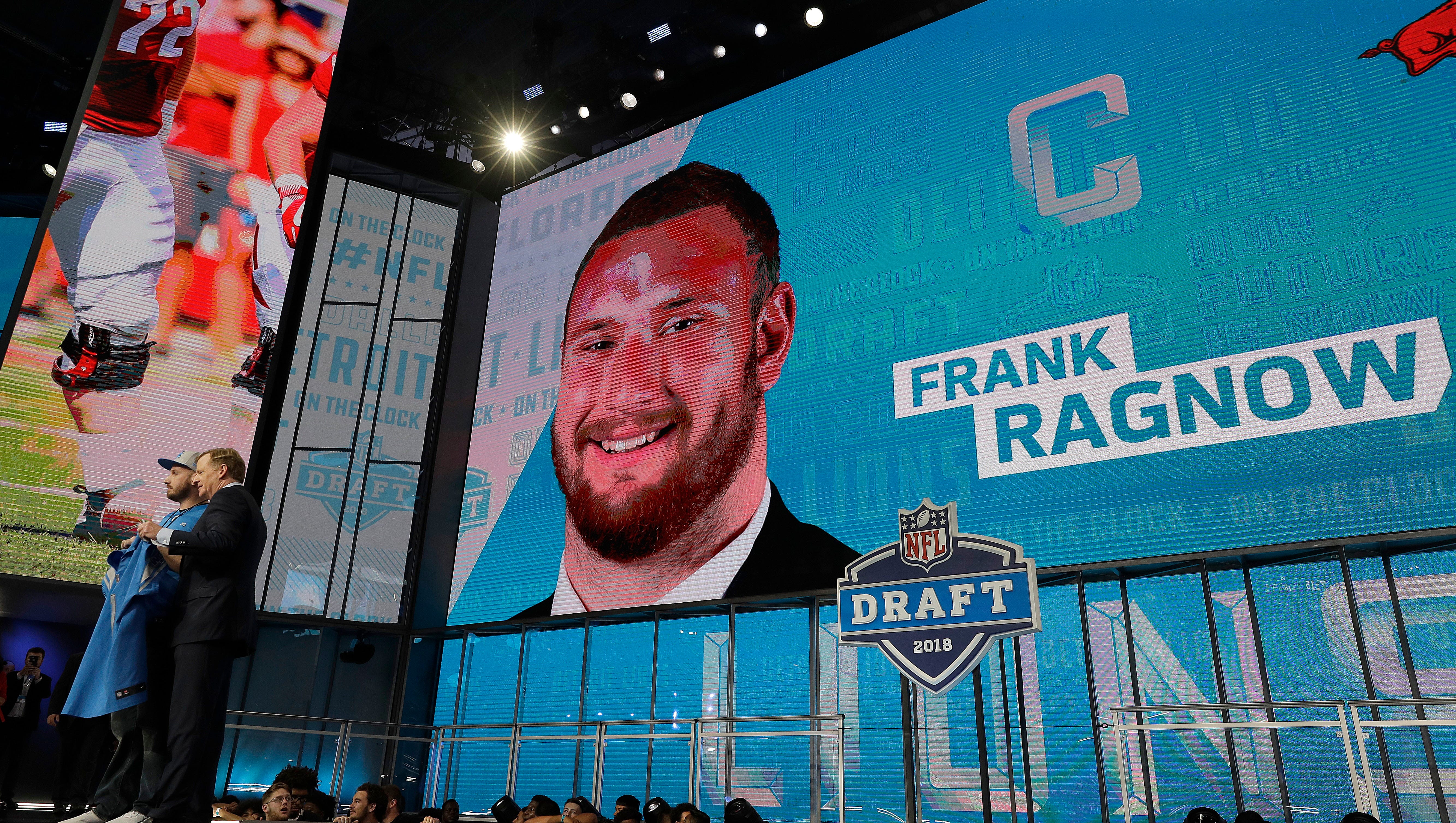 Commissioner Roger Goodell, left, poses with a fan after the Detroit Lions selected Frank Ragnow during the first round of the NFL Draft on Thursday.