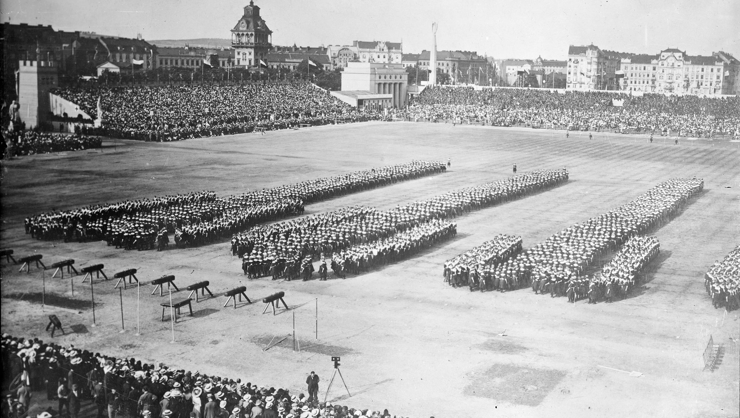 Ideas about exercise were imported from Europe.This 1912 exhibition by a European exercise and health organization called the Sokols shows young women standing in formation, probably during the Sokol Slet (gymnastic festival) held in Prague.  The Sokols Detroit exercise club was formed by immigrants from a variety of Central European countries.
