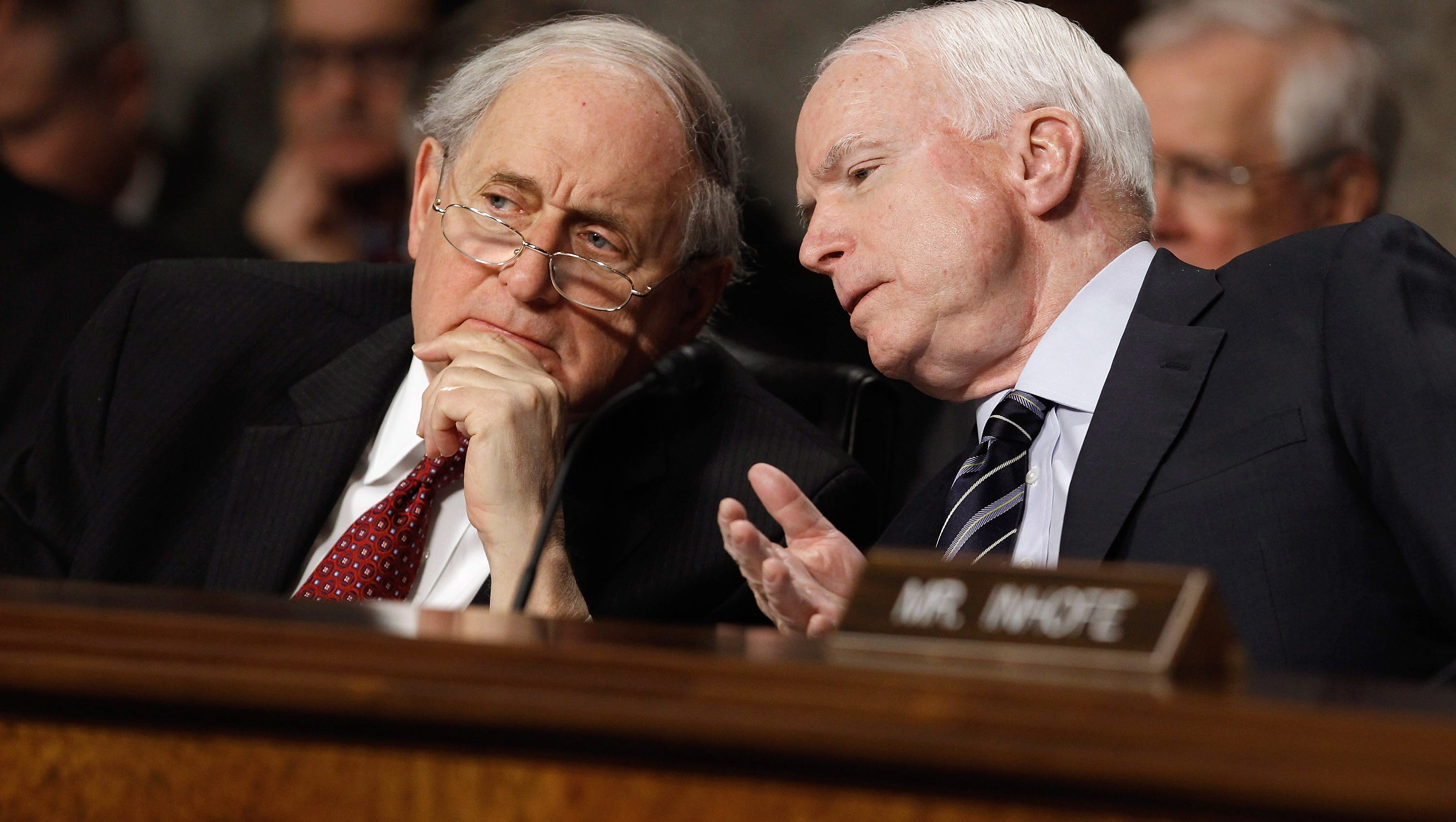 Senate Armed Services Committee Chairman Sen. Carl Levin and ranking member Sen. John McCain, R-Ariz., talk during a hearing about worldwide threats to the security of the United States on Capitol Hill Feb. 16, 2012. He has “made a major contribution to the nation’s security,” said McCain, who disagreed with Levin on many issues but still forged an amiable working relationship.