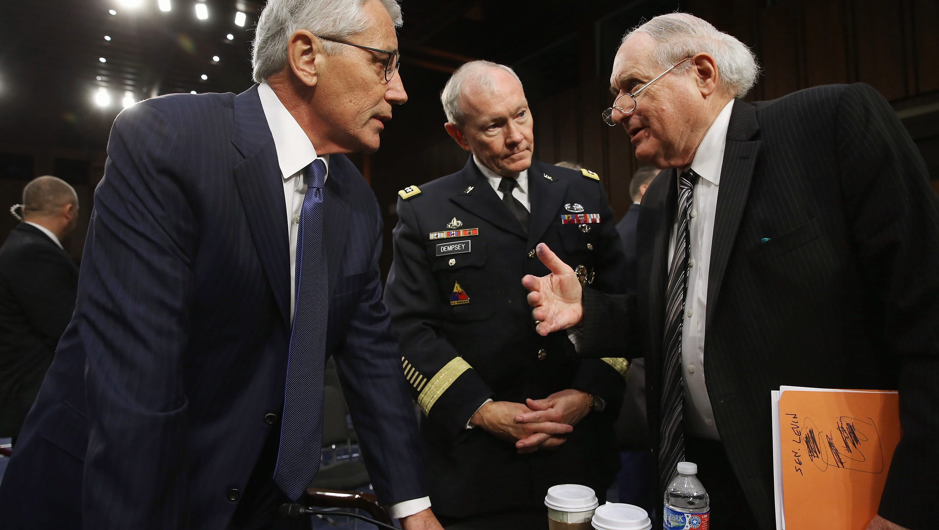 U.S. Defense Secretary Chuck Hagel, left, Chairman of the Joint Chiefs of Staff Army Gen. Martin Dempsey and Carl Levin after a hearing in the Hart Senate Office Building on Capitol Hill Sept 16, 2014. Senators questioned the top military and civilian leaders about the threat posed by the terrorist group Islamic State of Iraq and the Levant or ISIL.