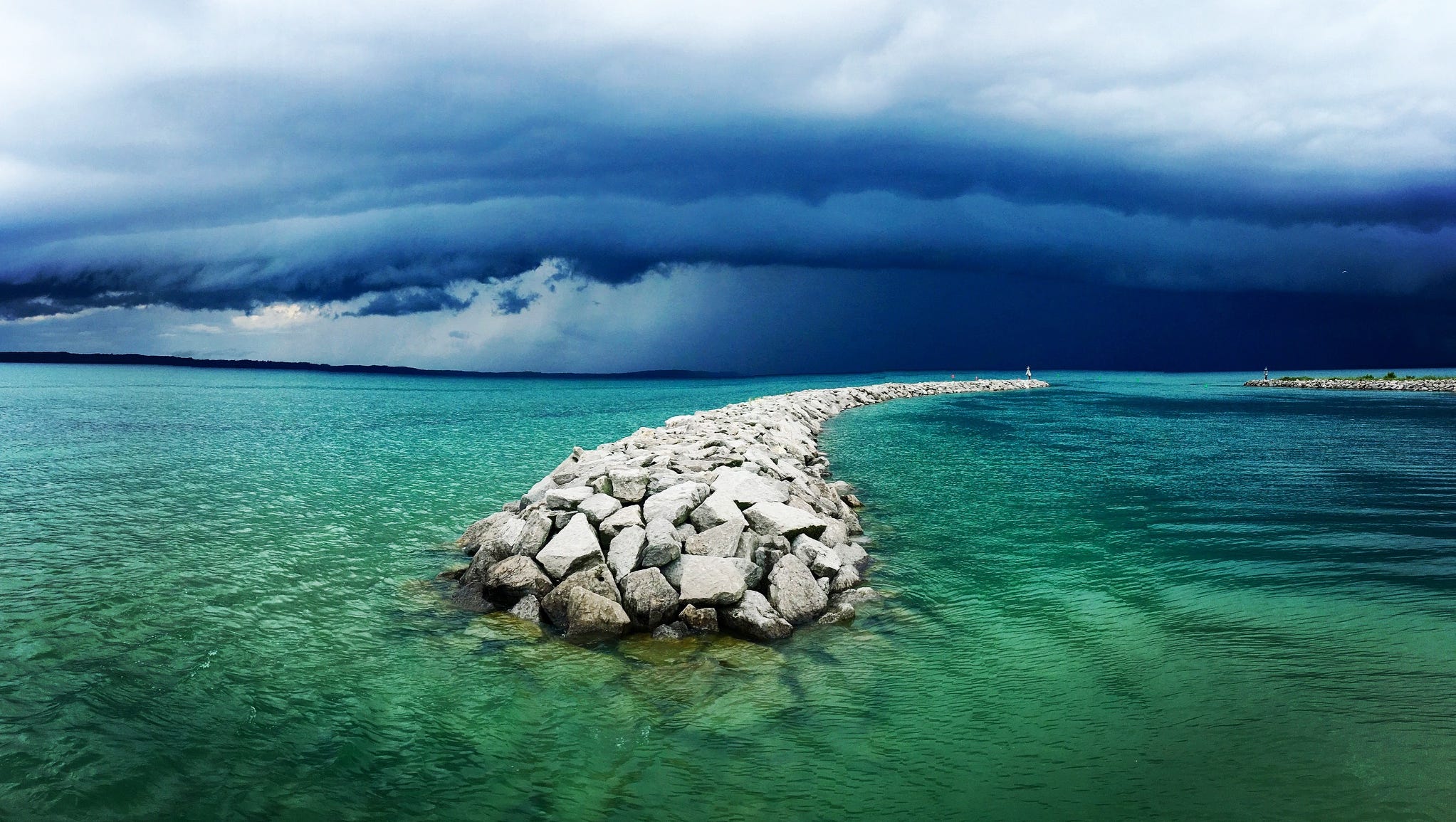 Honorable Mention: A stone pier in Elk Rapids cuts through the green waters of Traverse Bay in "Storm Rolling Away on Traverse Bay," by Rick Motyl of Troy. This was also a finalist in the digitally enhanced category.
