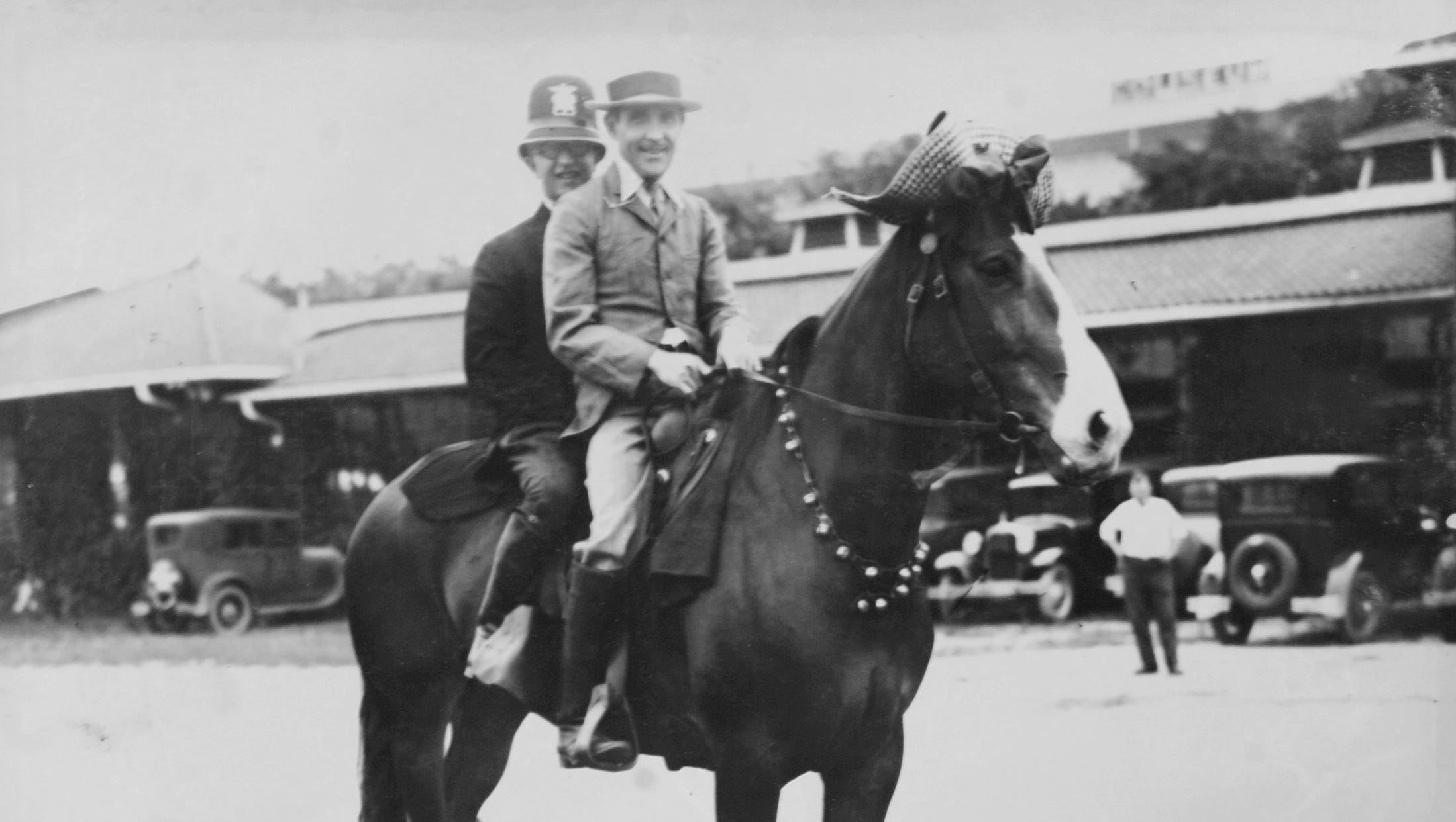 The first early morning comedy team on WWJ -- Arnold Tiemann, left, and Franklyn Greenwood -  pose on a horse in 1932.
