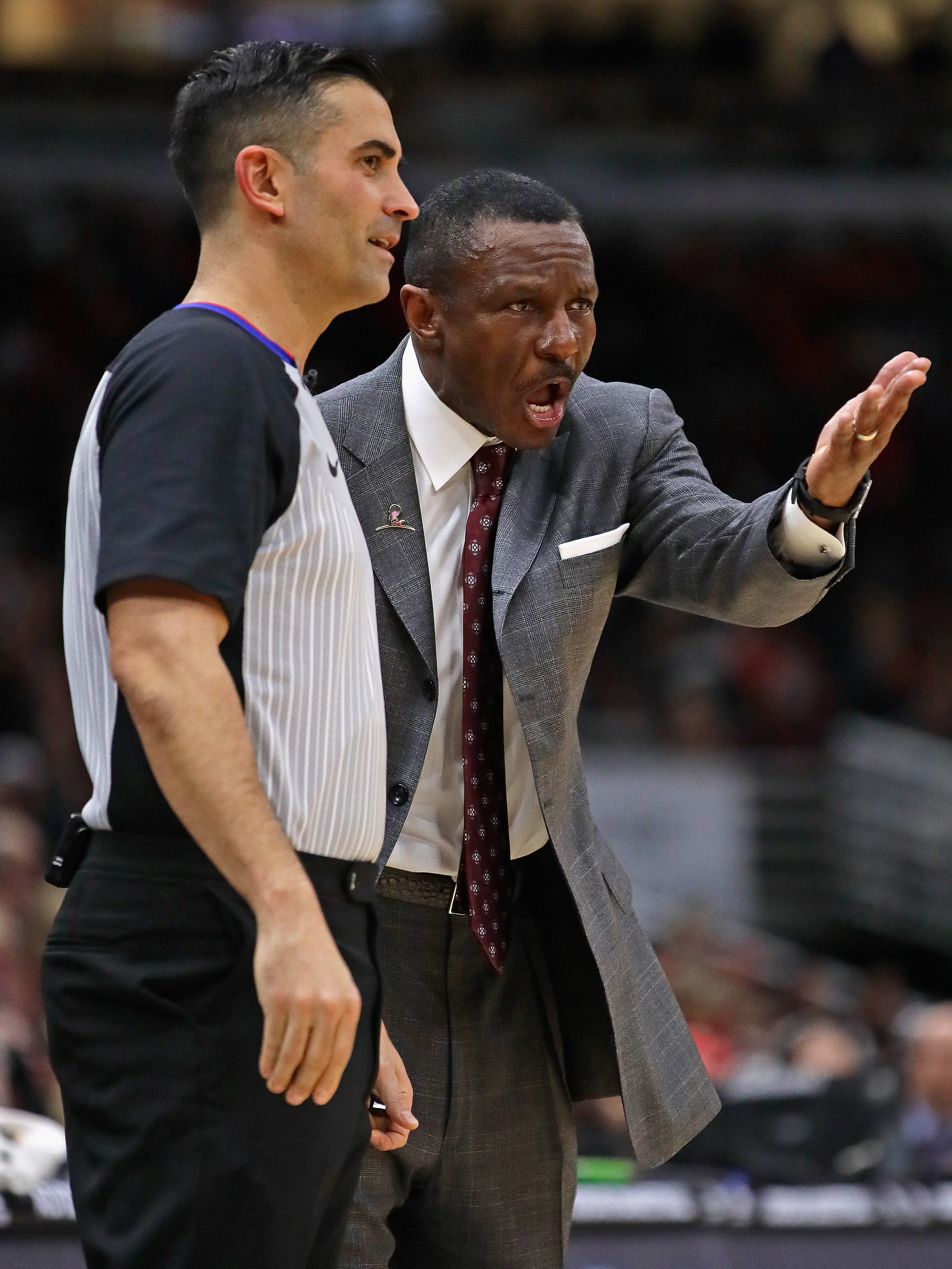 Head coach Dwane Casey argues with referee Zach Zarba #15 during a game against the Chicago Bulls at the United Center on February 14, 2018 in Chicago, Illinois. The Raptors defeated the Bulls 122-98.