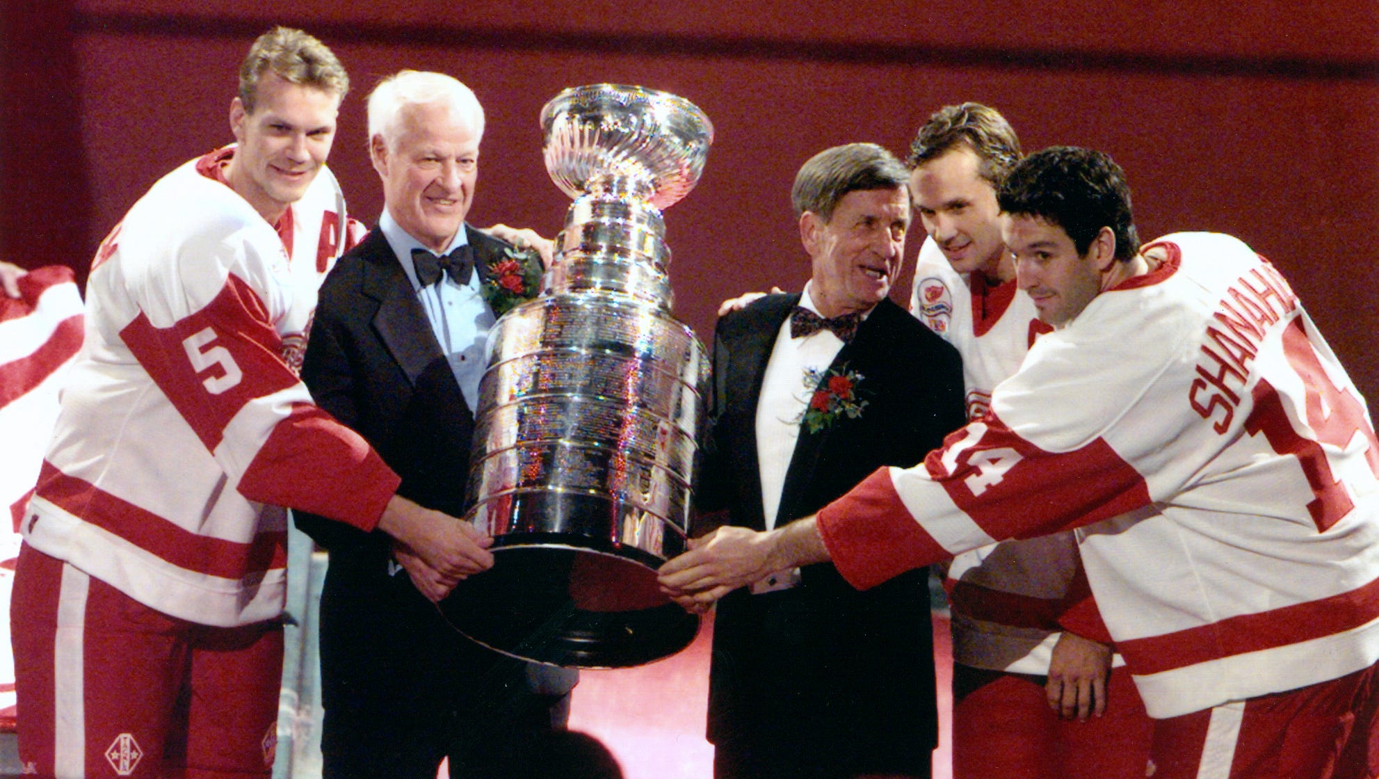 From left, Nicklas Lidstrom, Gordie Howe, Ted Lindsay, Steve Yzerman and Brendan Shanahan pose with the Stanley Cup, which they won the previous season, during Stanley Cup banner night at the Red Wings home opener in 1997.