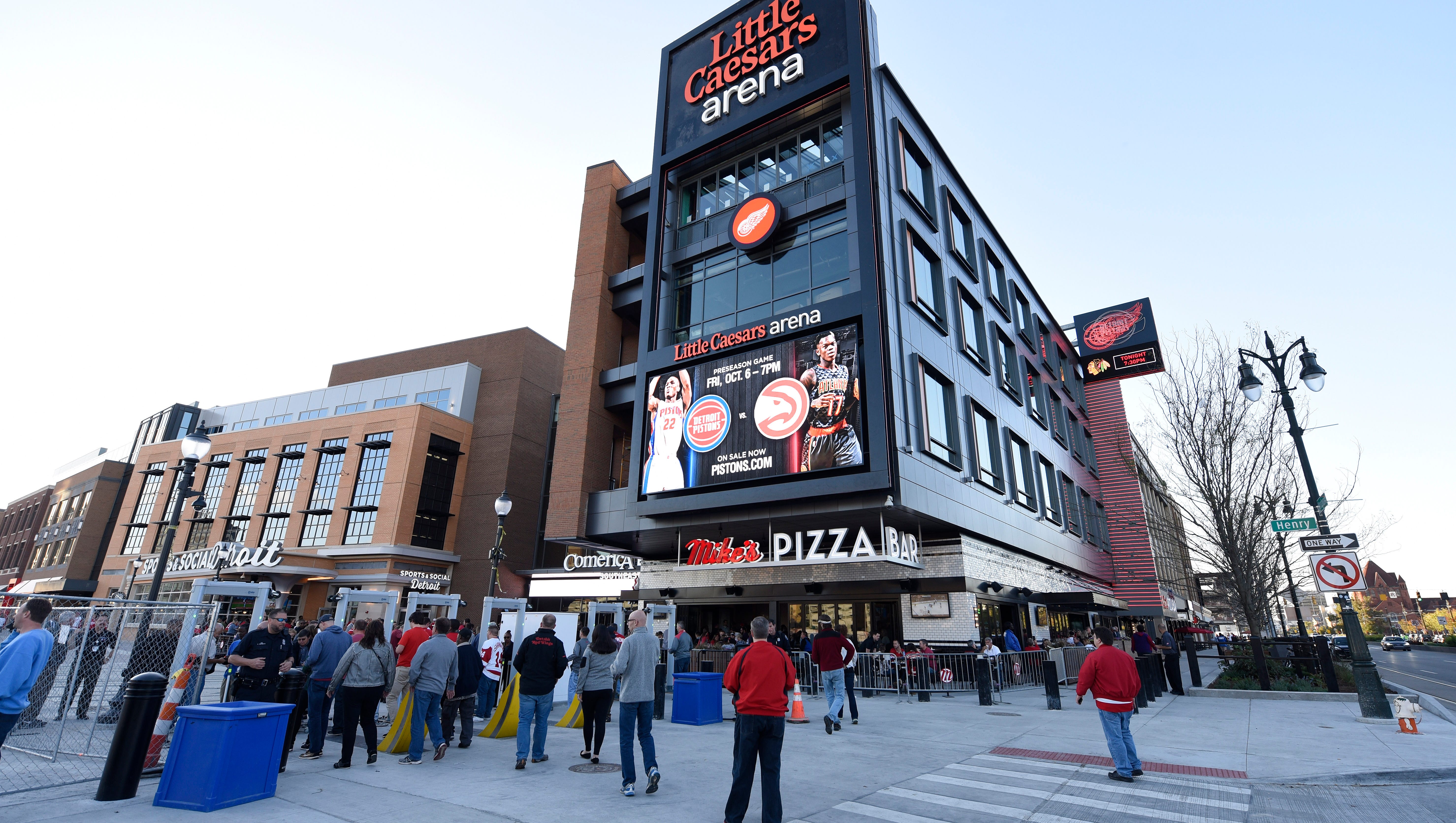 Fans arrive at Little Caesars Arena for a preseason Red Wings game.