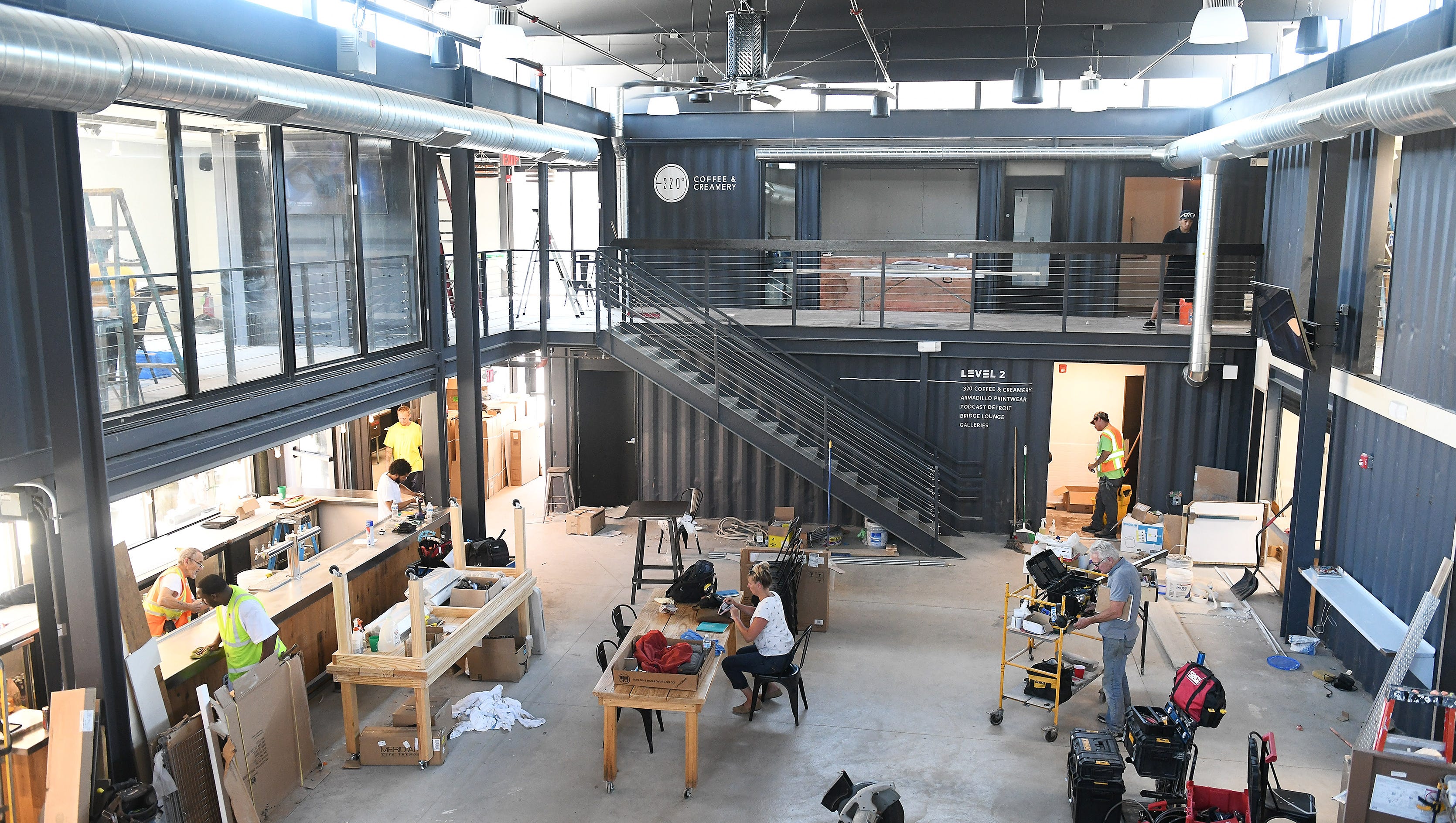 A view from the second level of the indoor food hall and bar which has an open feel and natural light from above at Detroit Shipping Co. on Peterboro Street in Detroit on July 9, 2018. Detroit Shipping Co. is comprised of 22 shipping container and houses five restauranteurs, a coffee shop and an outdoor courtyard with a stage.