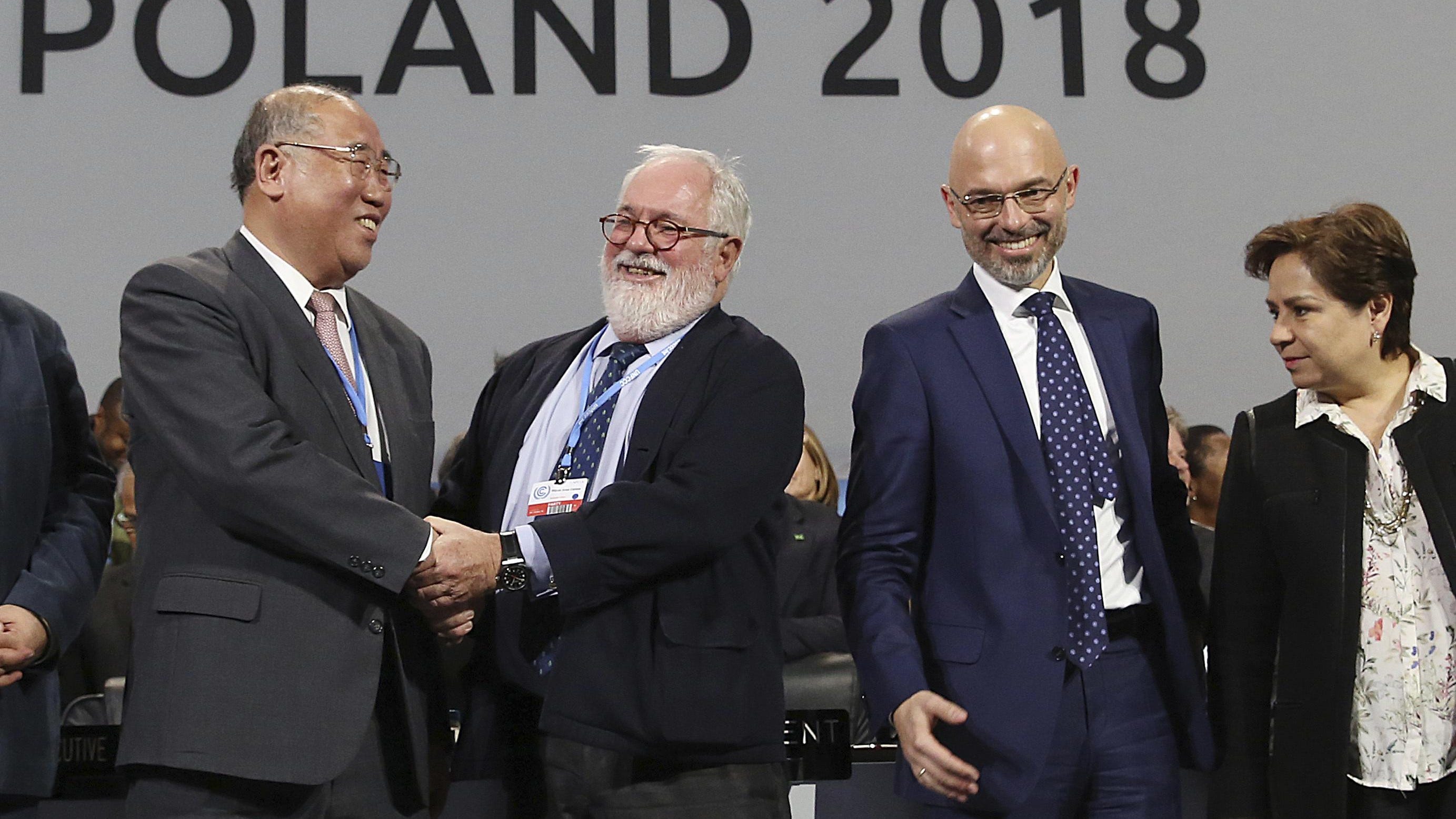 Heads of the delegations react at the end of the final session of the COP24 summit on climate changein Katowice, Poland, Saturday, Dec. 15, 2018.