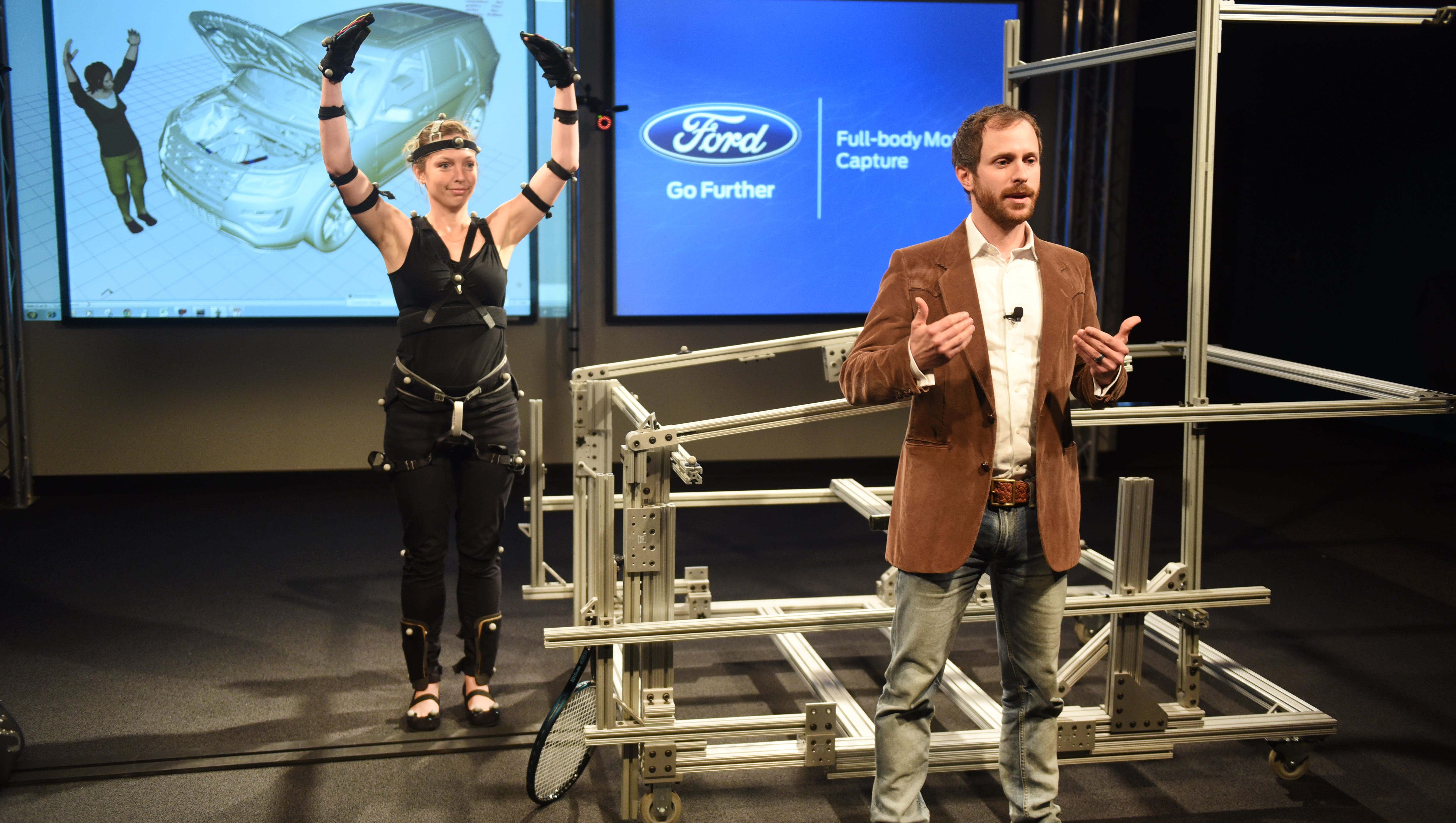Ergonomics Engineer Marty Smets talks about Virtual Manufacturing Technology, which reduces production line injuries, as Ergonomist Kali Gawinski demonstrates the full body motion capture.
