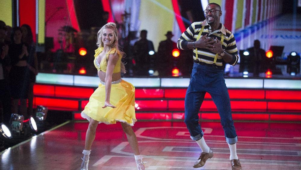 Lindsay Arnold and Calvin Johnson, dressed as Steve Urkel, dance to the theme song of "Family Matters" during TV Night on "Dancing with the Stars."