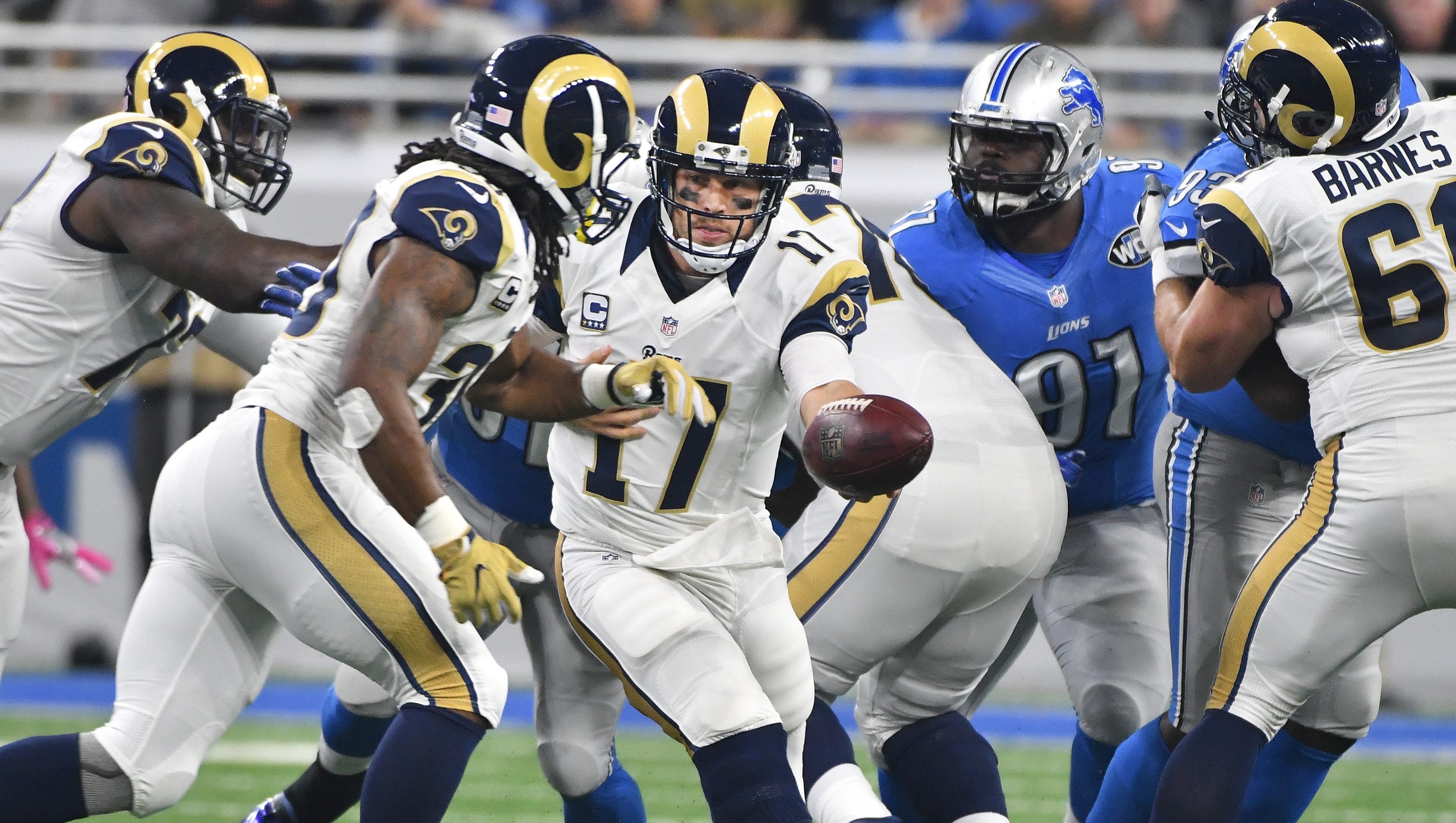 Rams quarterback Case Keenum hands off to running back Todd Gurley in the first quarter.