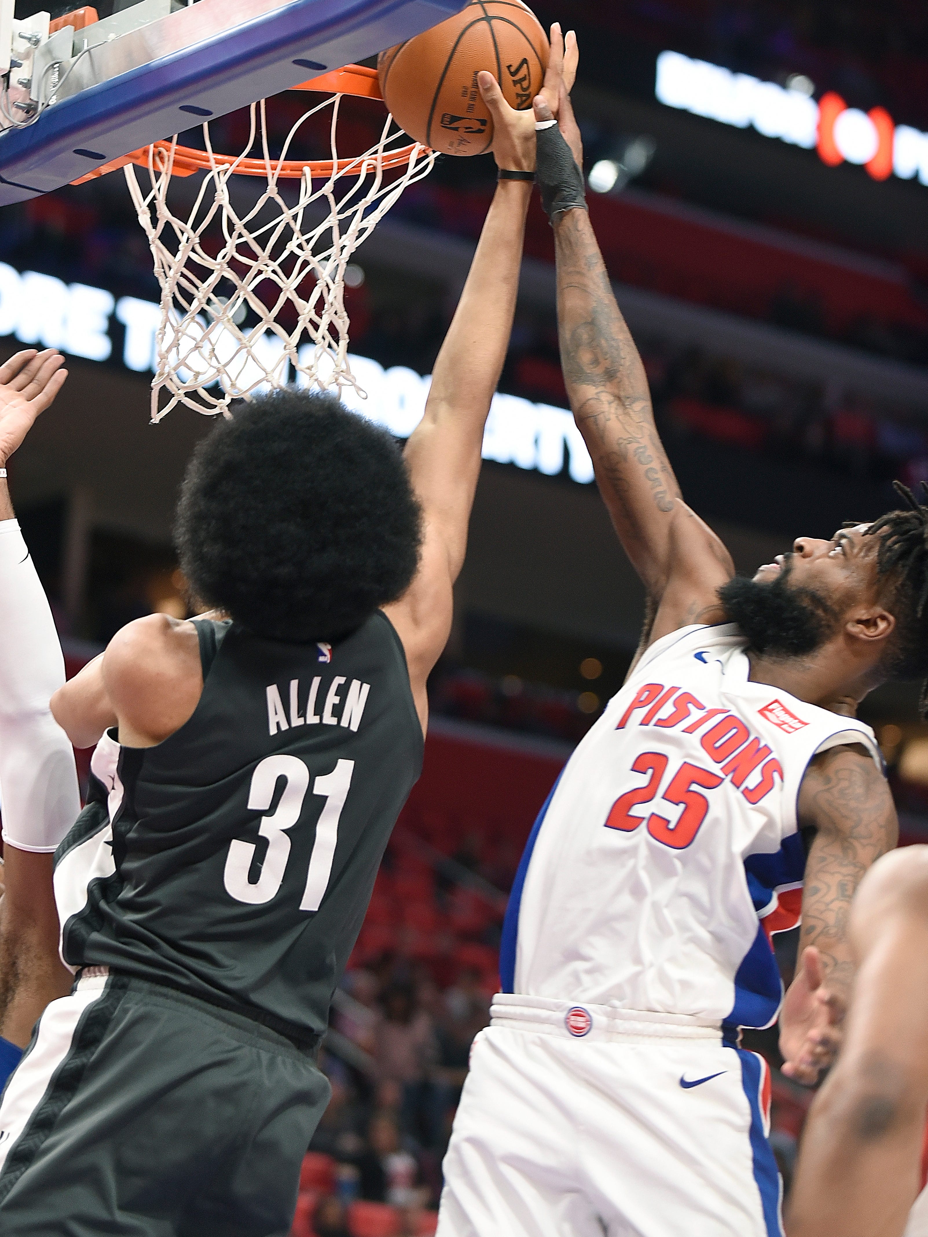 Pistons' Reggie Bullock blocks the shot of Nets' Jarrett Allen in the second quarter.