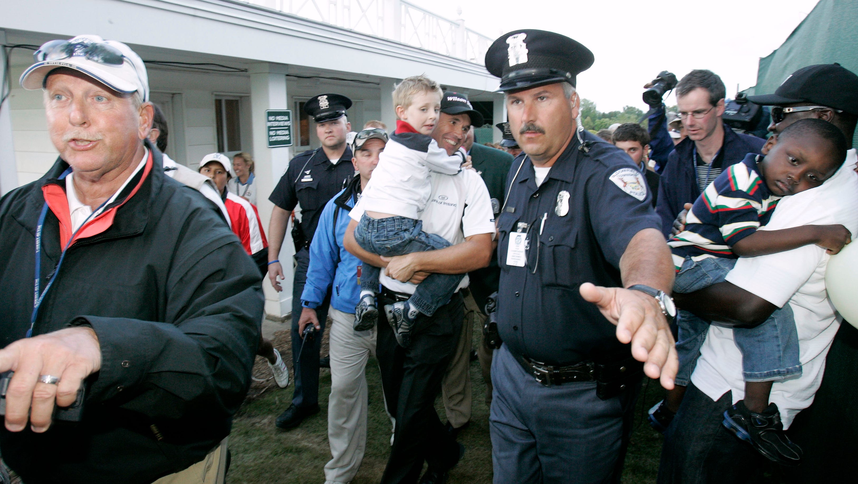 Padraig Harrington gets a police escort to make his way through the crowds after winning the 2008 PGA Championship.