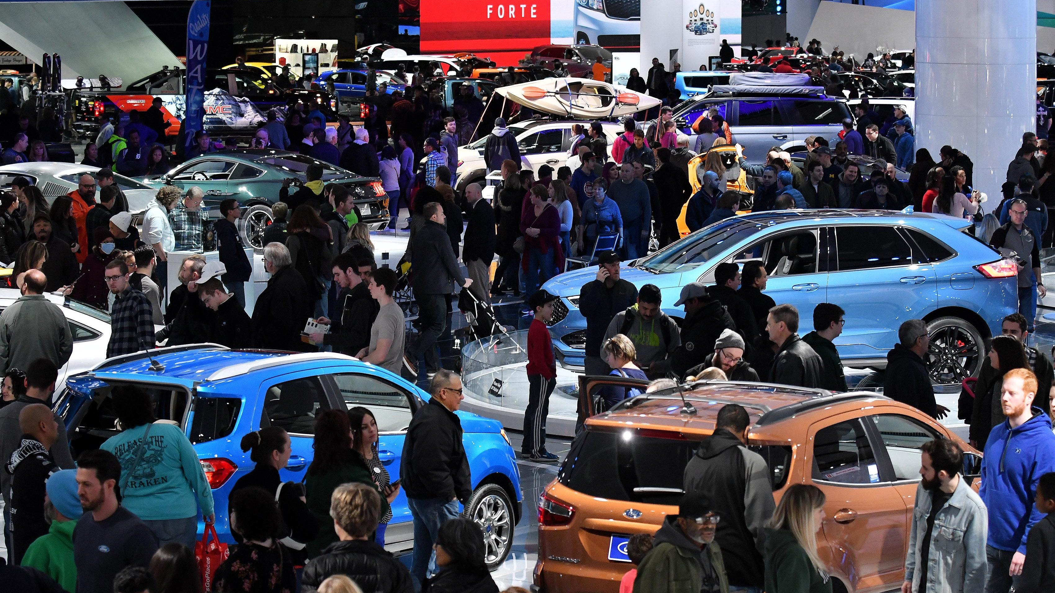 Crowds flow amongst the vehicles at the final day of the North American International Auto Show at Cobo Center in Detroit on Jan. 28, 2018. Organizers of Detroit’s big auto show are talking about moving it from frigid January to October starting as early as 2020.