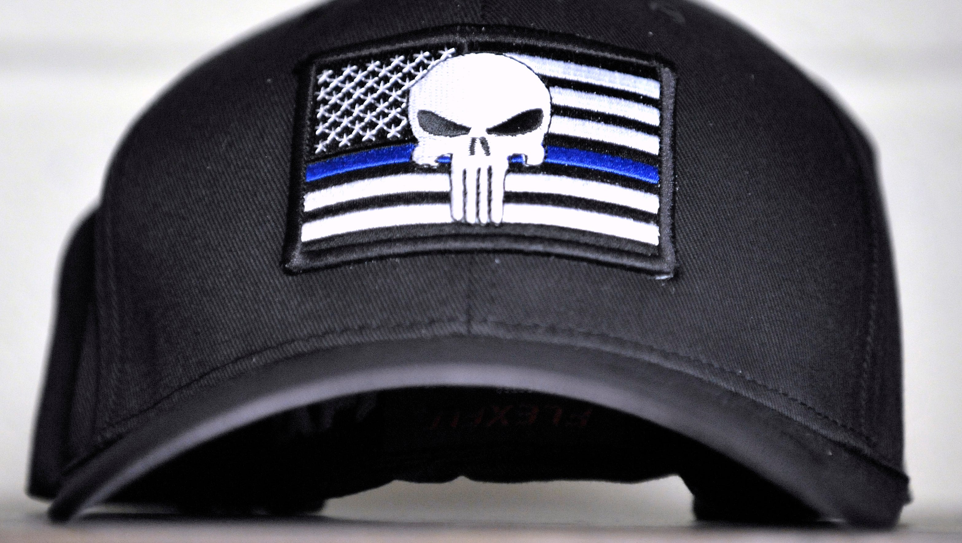 This is a TBL USA Punisher hat. TBL USA law enforcement liaison Jacob Bouchard says while talking about the hat, "at the end of the day, whether on this earth or somewhere else, the criminal always gets punished."