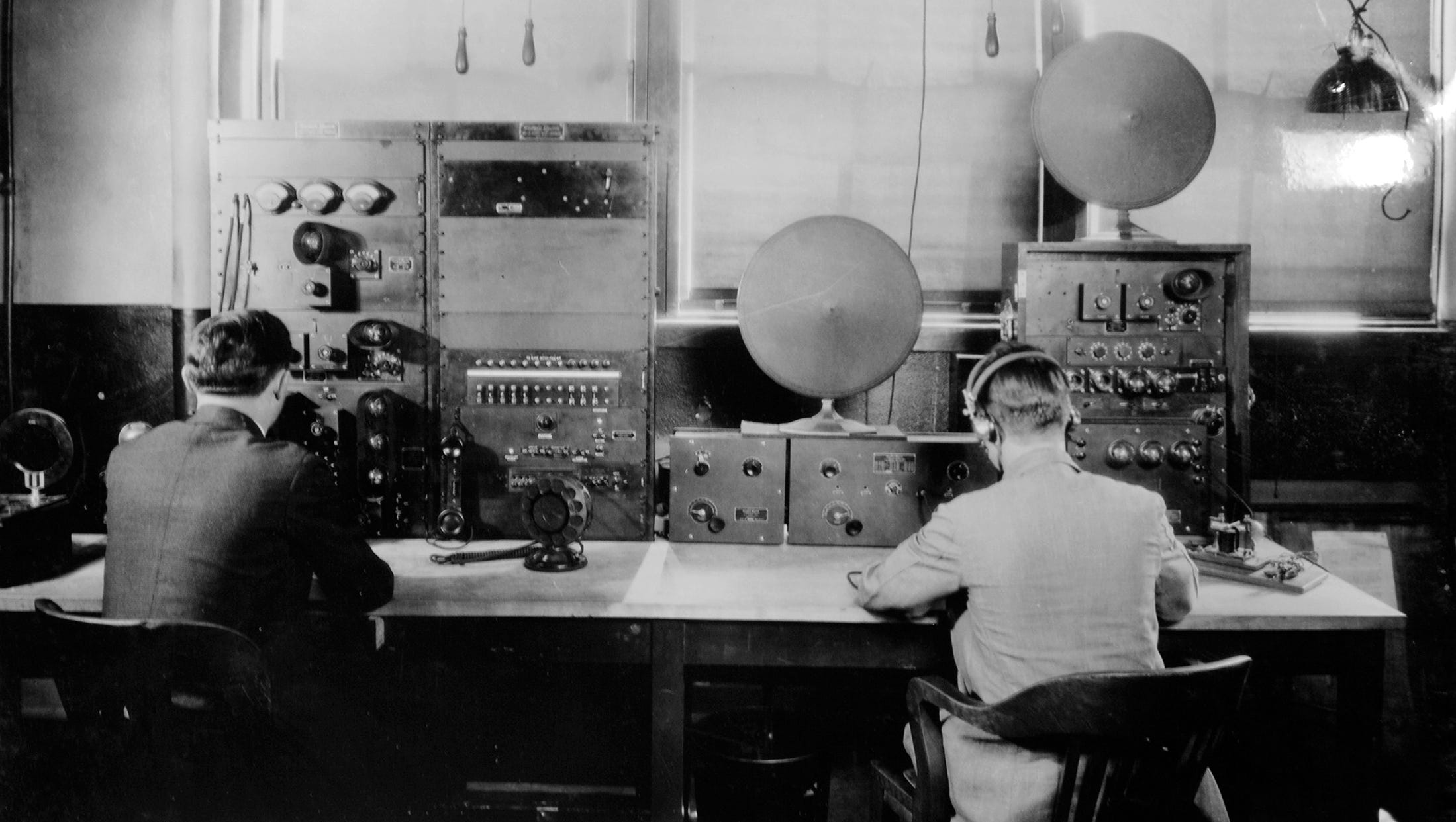 Radio operators Walter Hoffman, left, and Herbert Tank work WWJ's control panel in 1926.