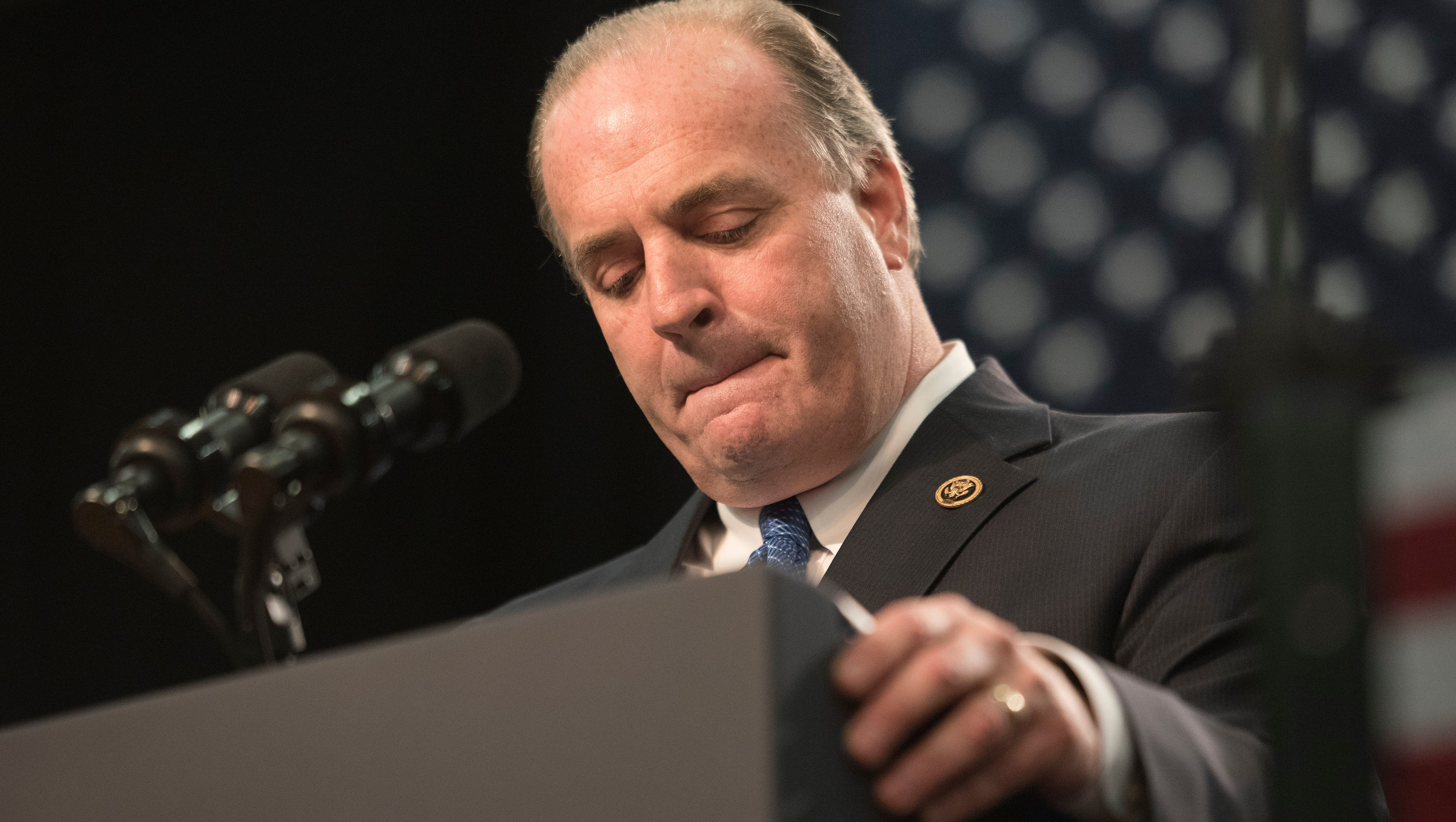 Flint resident Dan Kildee, United States Representative for Michigan's 5th District, takes a moment during his speech  at Northwestern High School in Flint.