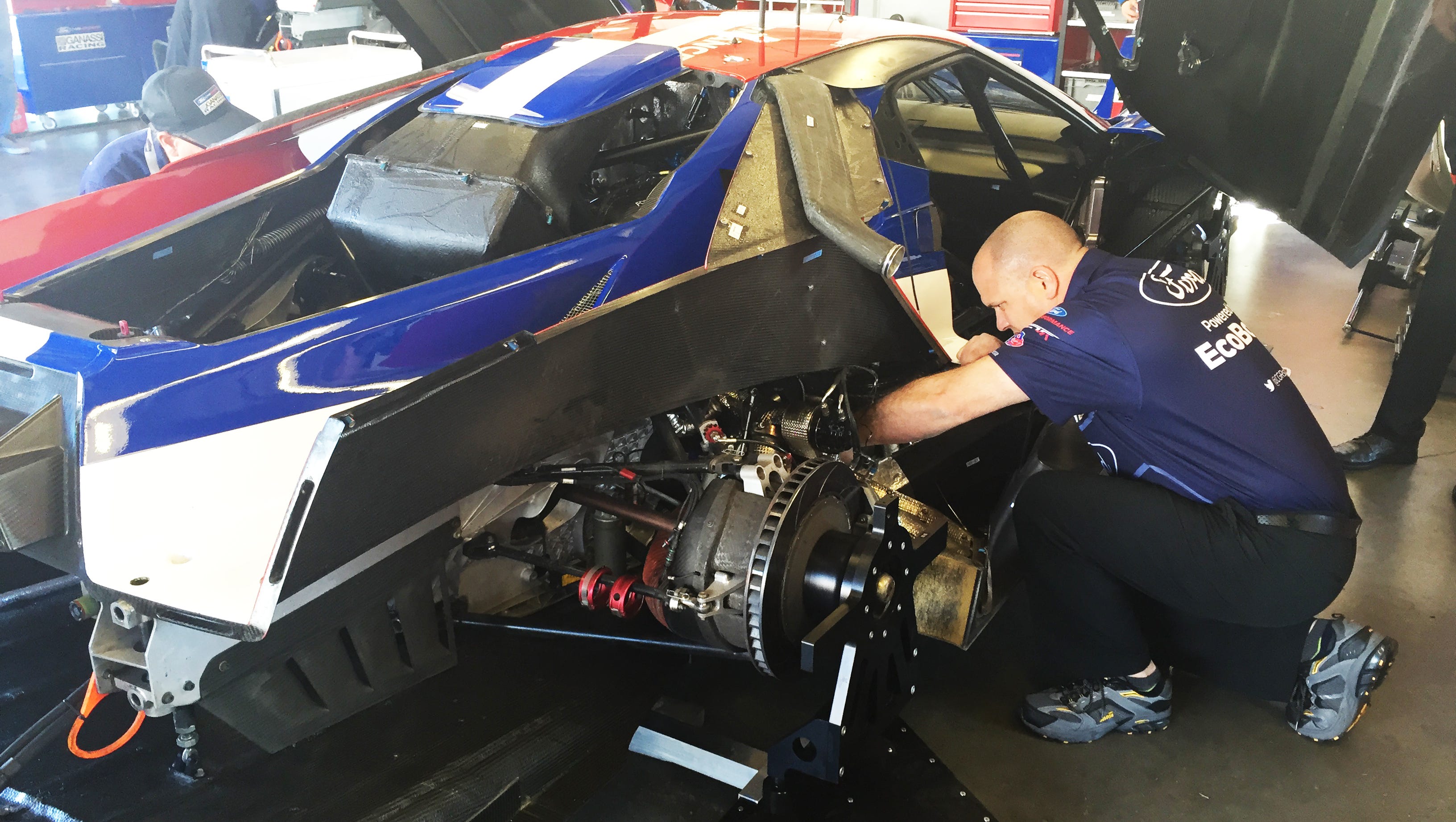 Members of Chip Ganassi Racing’s roughly 40-member pit crew tune up the Nos. 66 and 67 Ford GT cars the day before the  2016 Rolex 24 in Daytona.