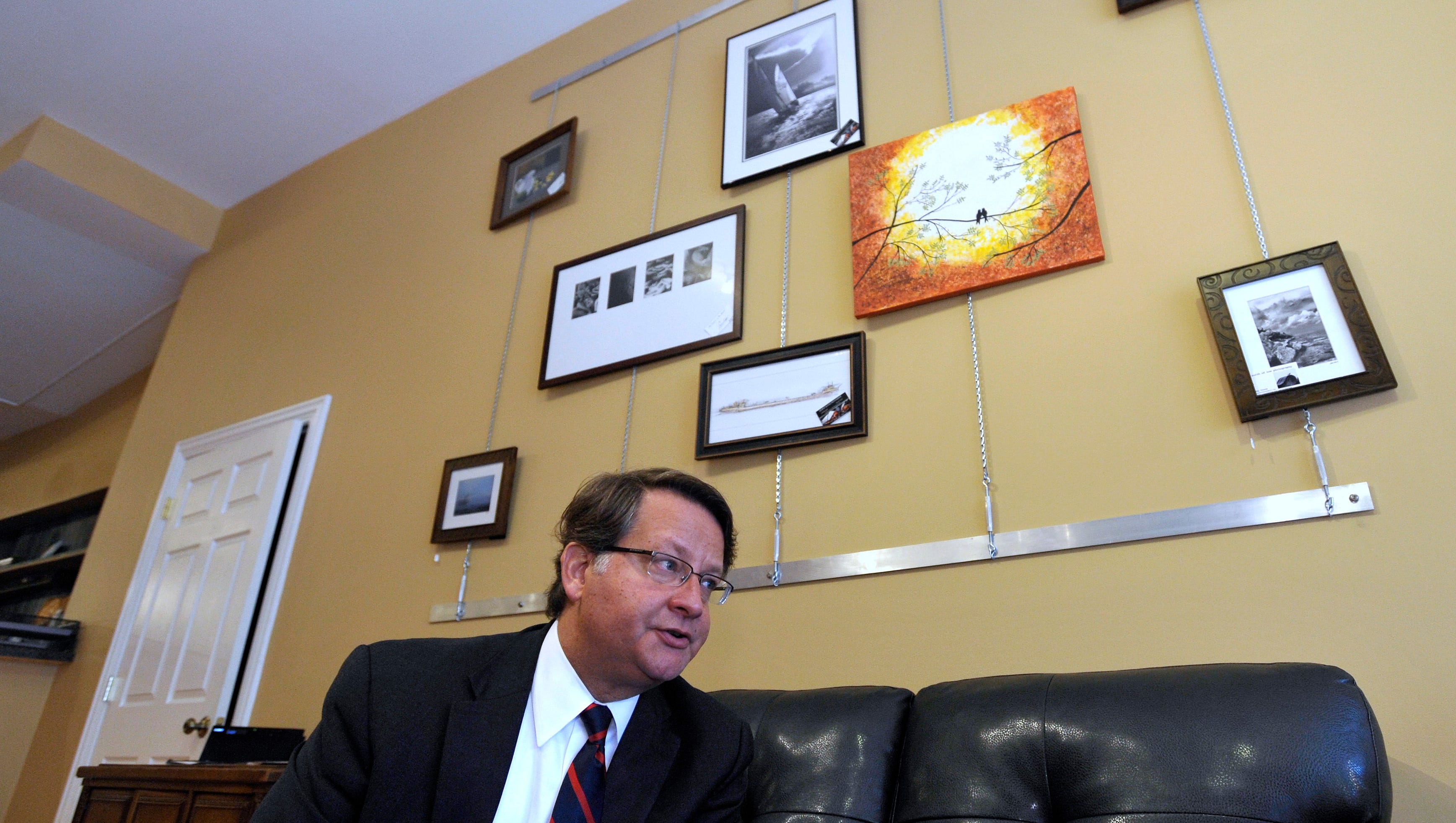 U.S. Congressman Gary Peters answers media questions during an interview at Port Huron Family Chiropractic.