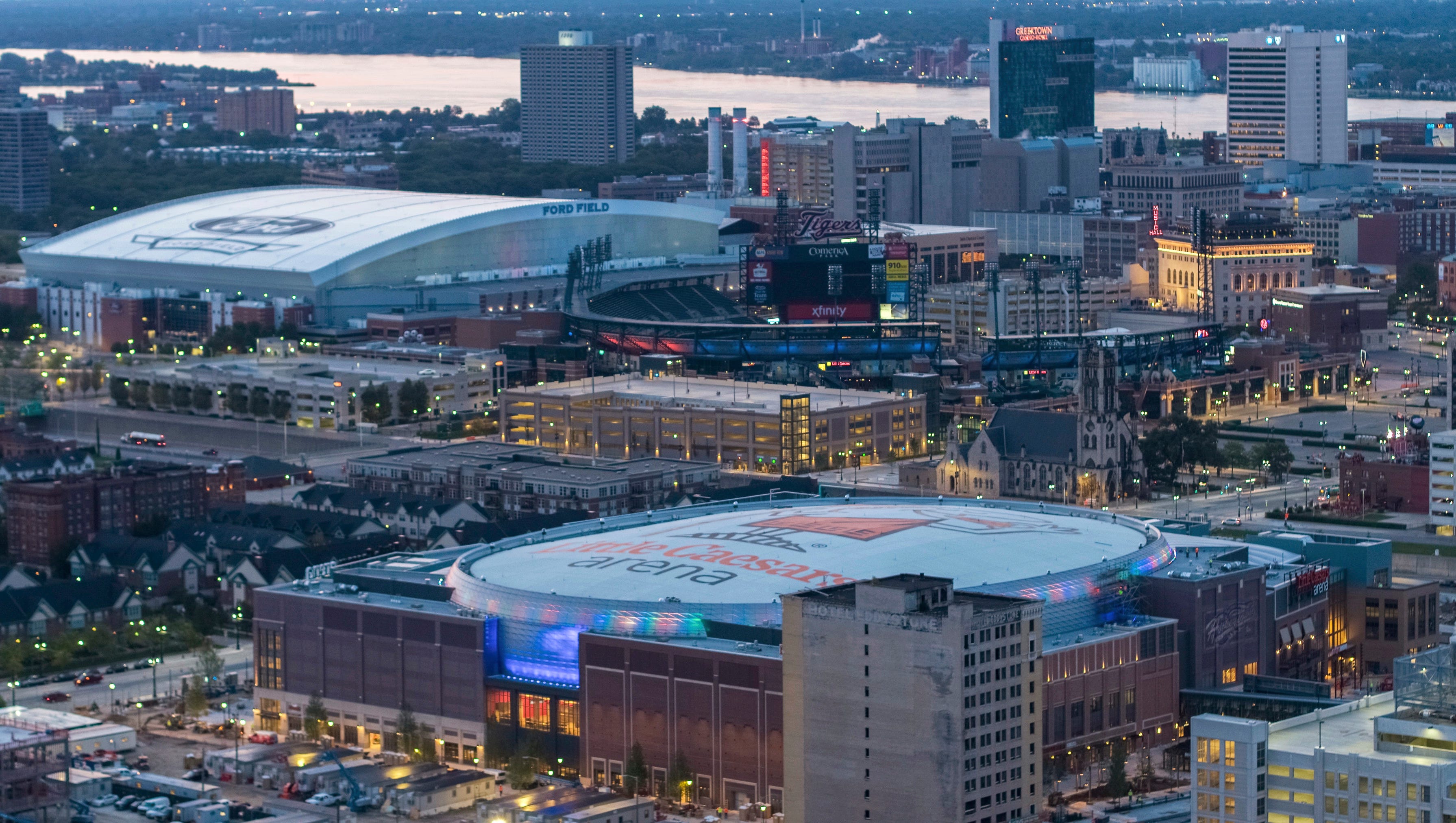 Little Caesars Arena, foreground, is seen in Detroit with Ford Field and Comerica Park in the background.