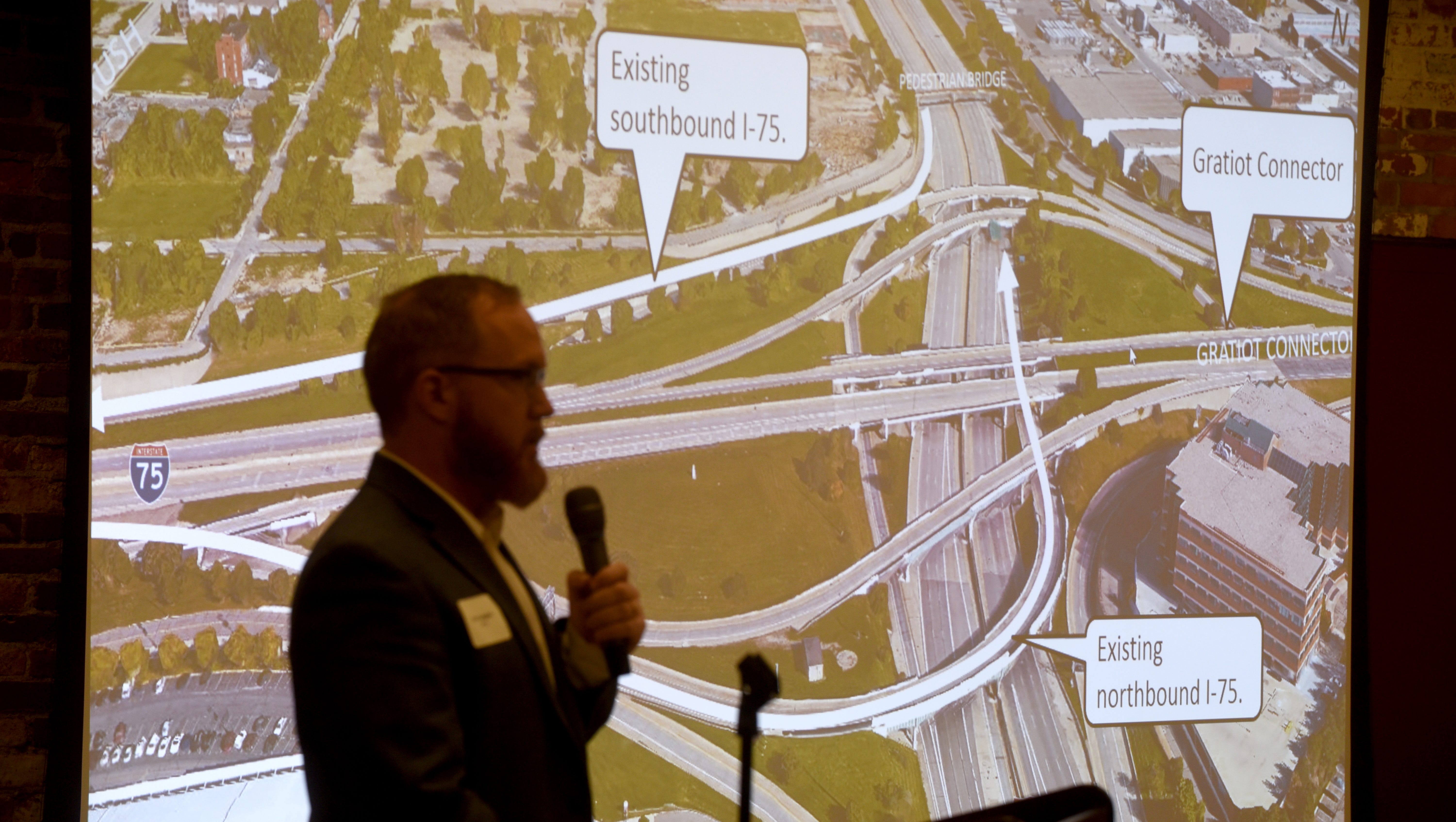 Dave Langlois, project engineer, HNTB, speaks to concerned citizens during the I-375 Improvement Project meeting Tuesday at the DNR Outdoor Adventure Center in Detroit.