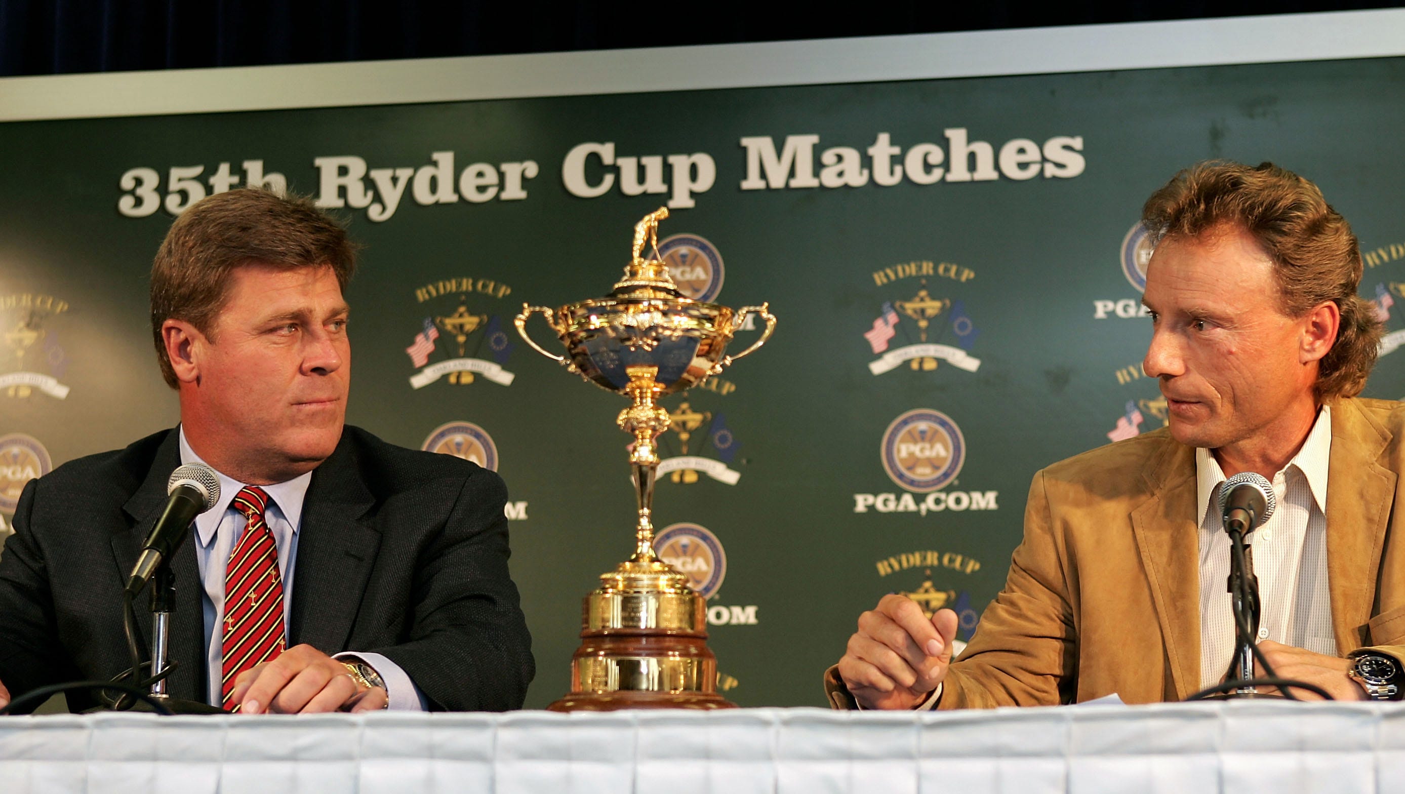 Team USA captain Hal Sutton, left, and Team Europe captain Bernard Langer stare each other down prior to the start of the 2004 Ryder Cup. Team Europe won, 18.5-9.5