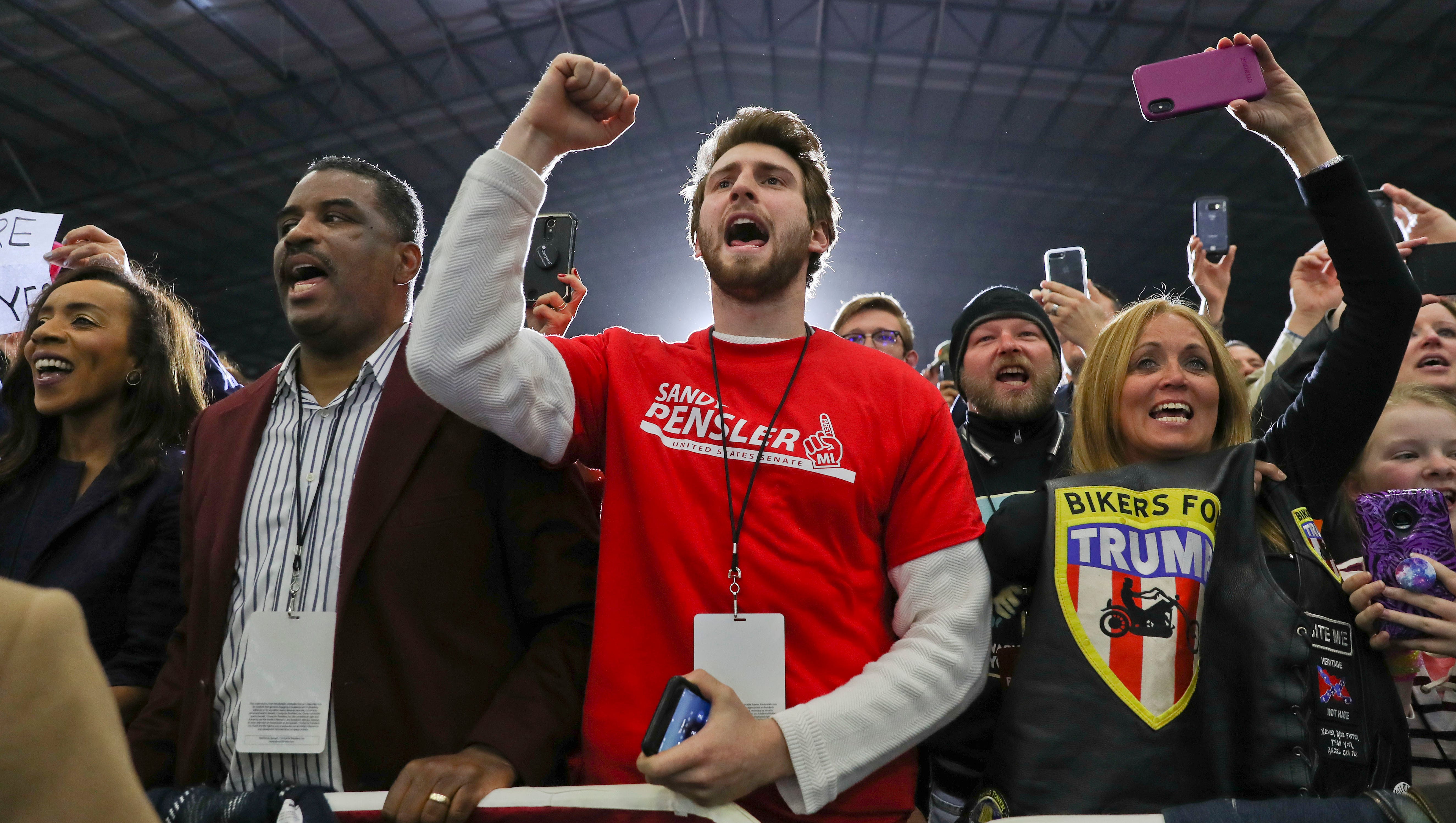 Supporters react to President Donald Trump being introduced at the rally,