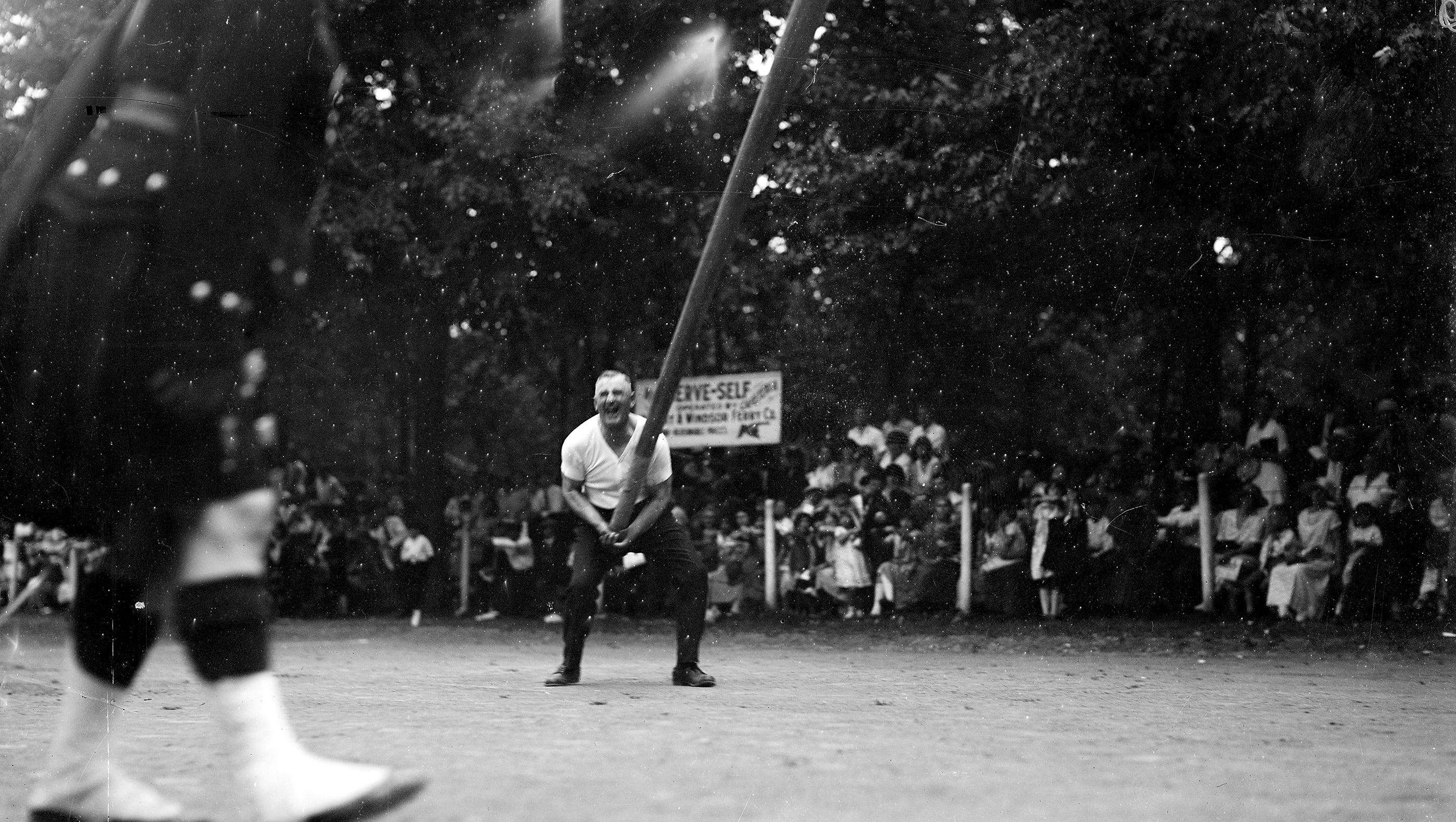 In a Scottish test of strength, a man tosses a caber at a St. Andrew's Society picnic on Boblo in the 1920s.