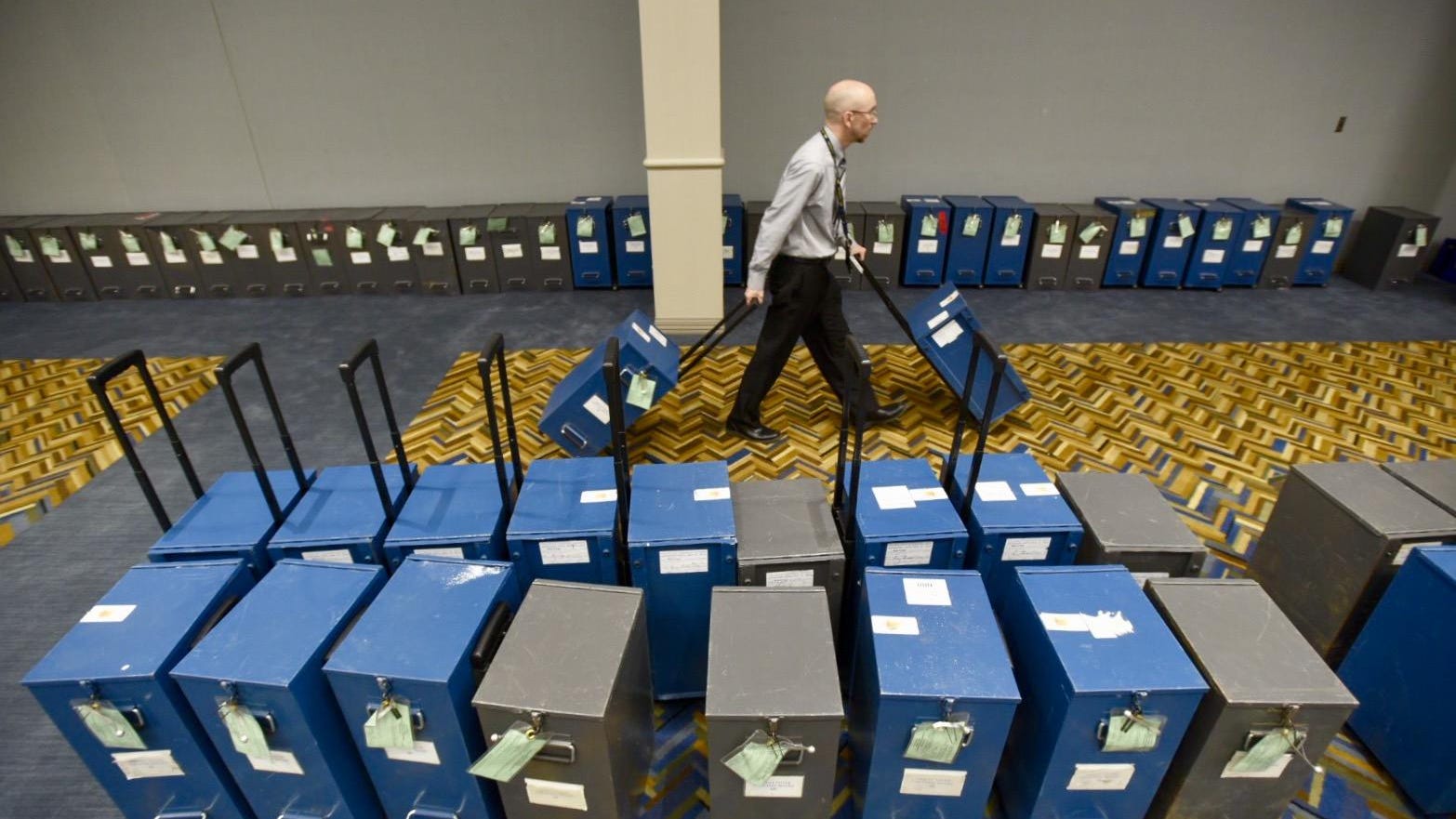 Greg Mahar, deputy executive for the Wayne County Clerk's Office, organizes ballot boxes in a storage room at Cobo Hall in preparation for a recount of Michigan votes, December 5, 2016.